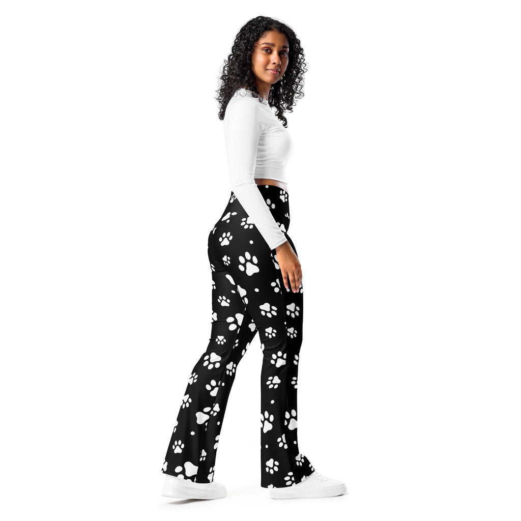 Women’s black high waist flare legging pants with white paw print pattern for casual and playful style