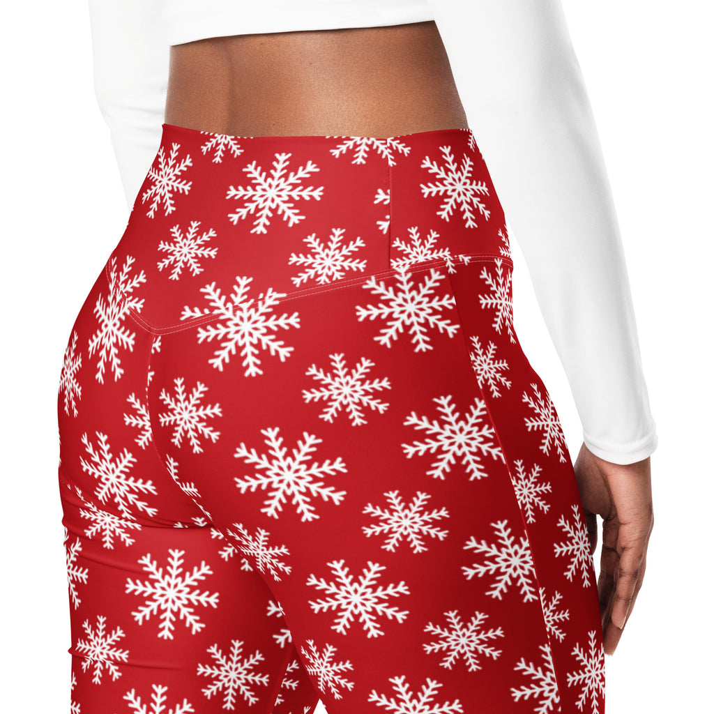 Women’s red high waist flare legging pants with a vibrant white snowflake pattern ideal for winter wear