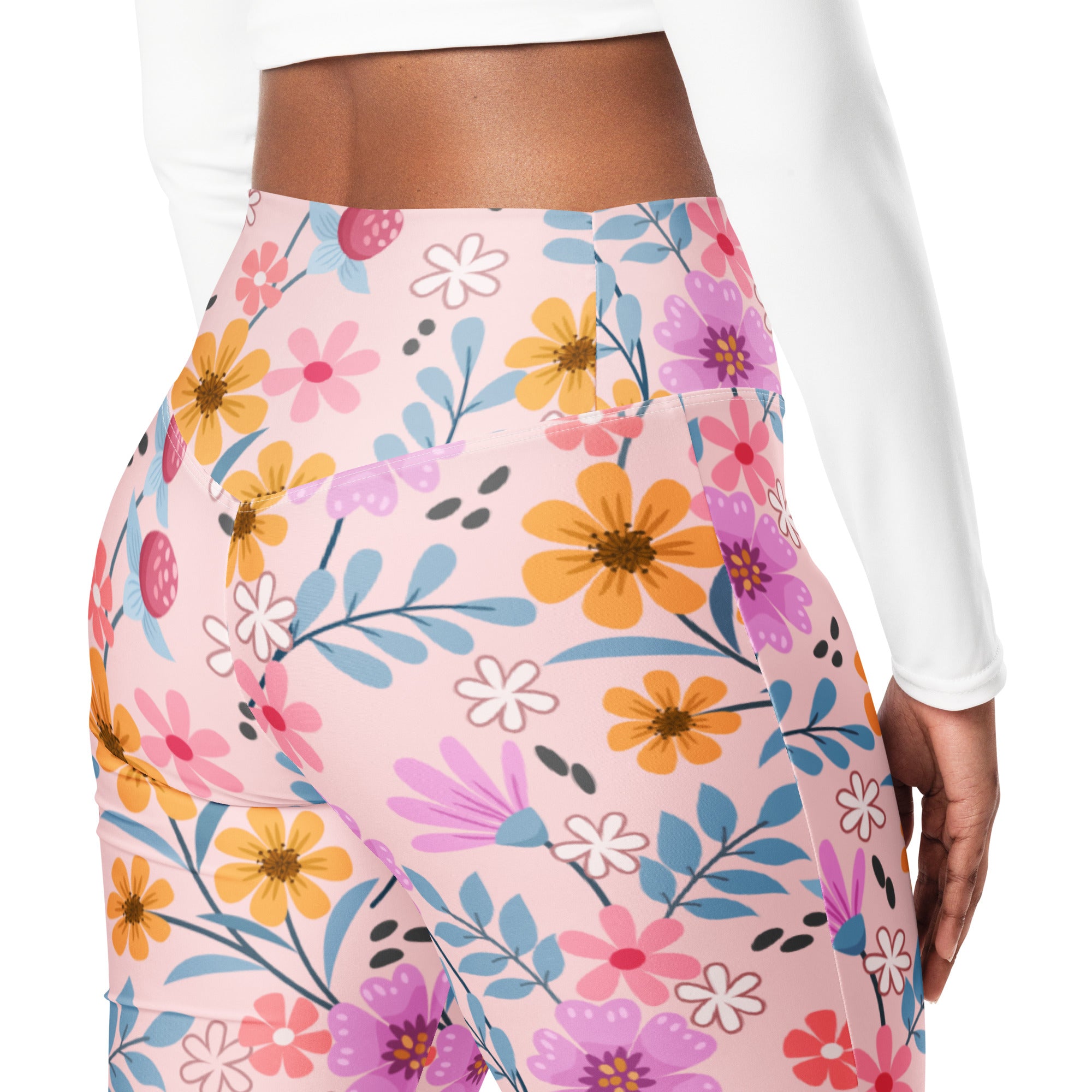 Women’s pink floral high waist flare leggings with vibrant yellow purple pink flowers and blue leaf accents