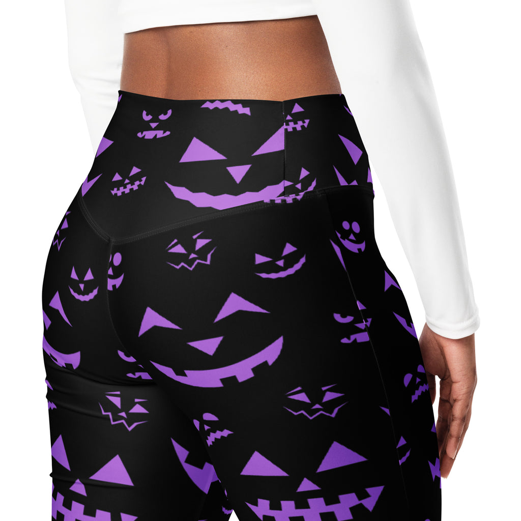 Black high-waisted leggings with vibrant purple jack o lantern pattern perfect for women’s Halloween wear