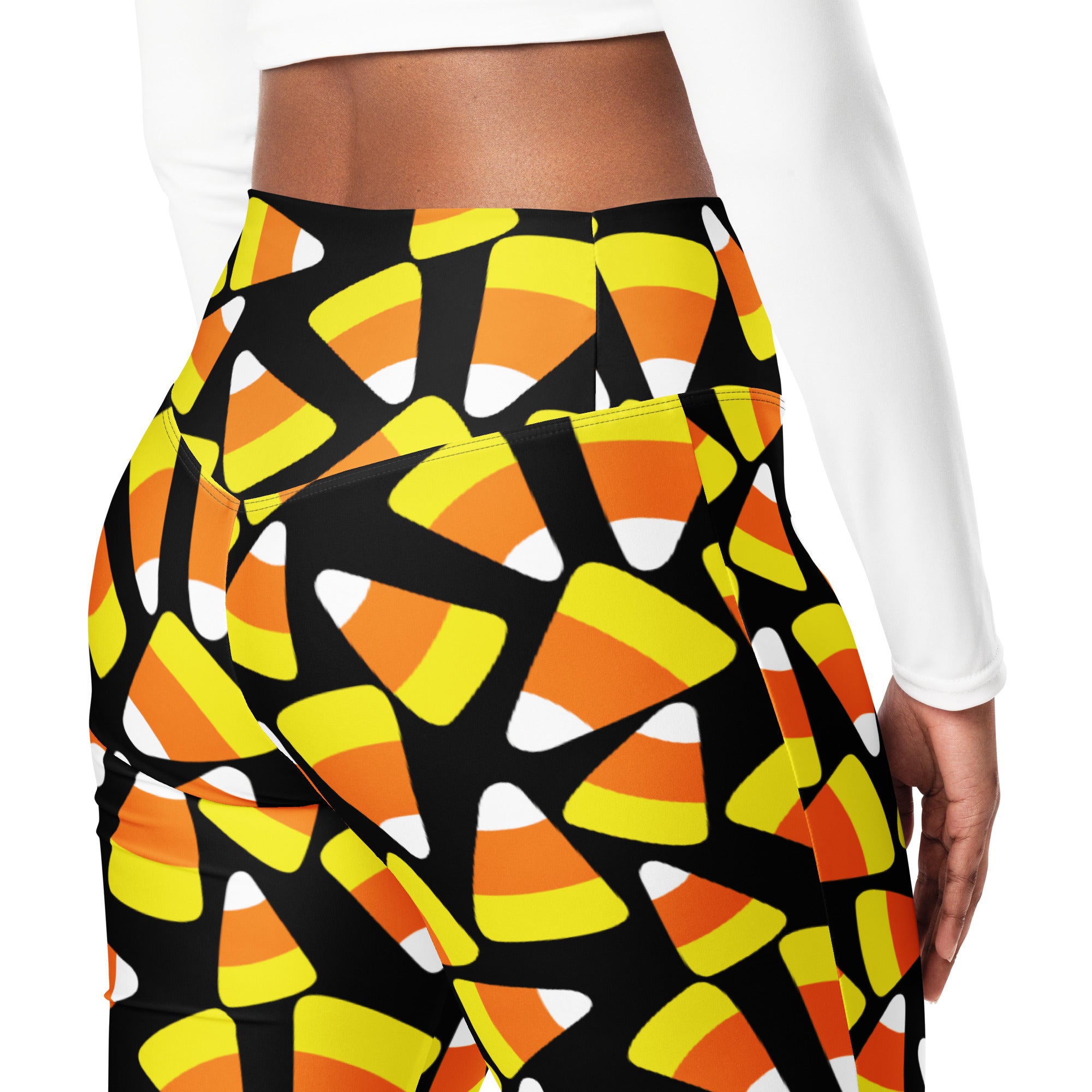 Black women’s high waist flare leggings with vibrant orange yellow and white candy corn pattern