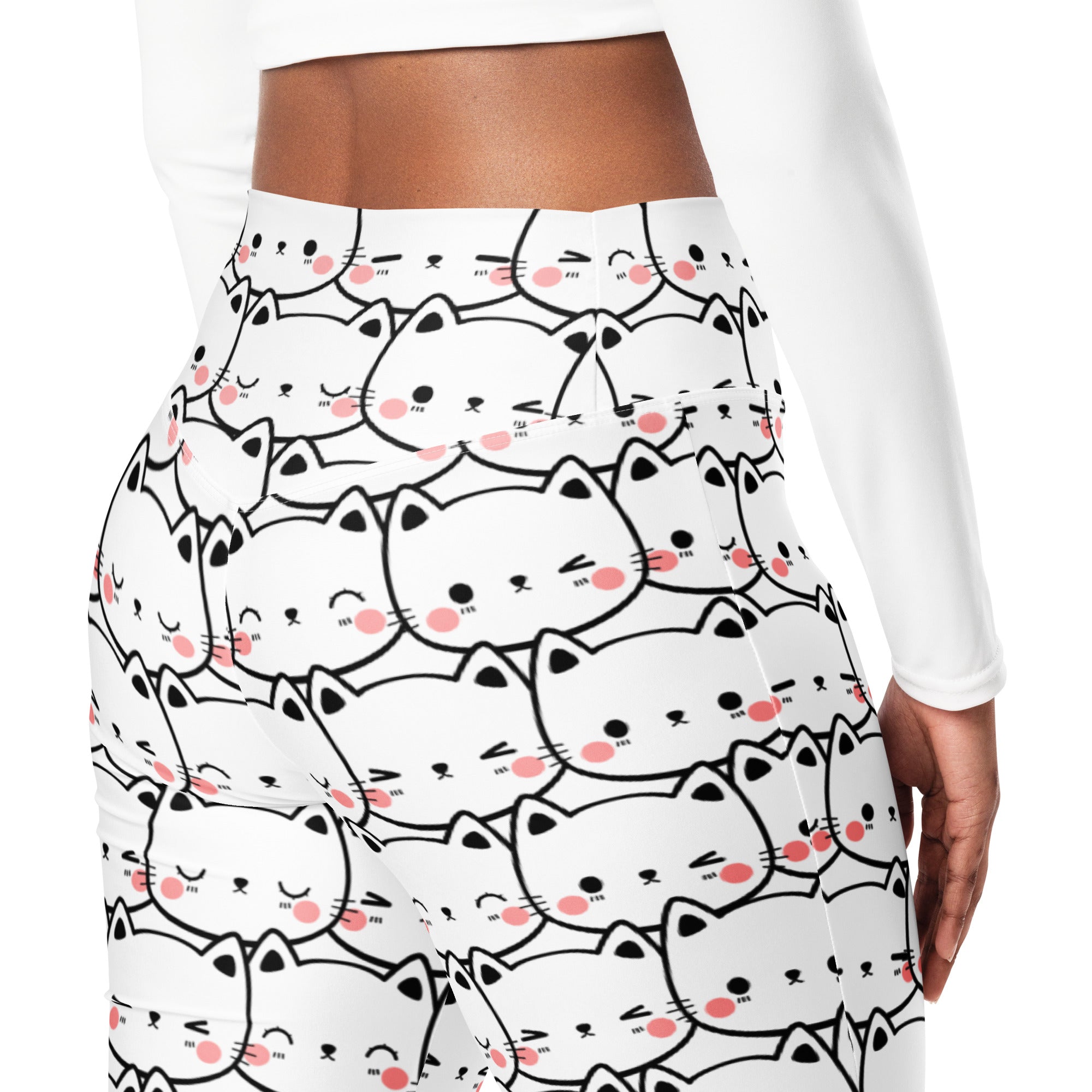 Women’s white high waist flare legging pants with playful black outlined cartoon cats and pink blush cheeks pattern