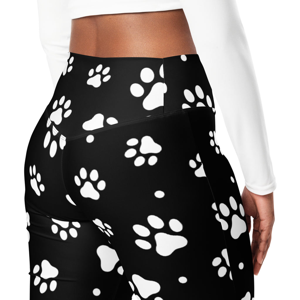 Women’s black high waist flare leggings with bold white paw print pattern perfect for casual wear