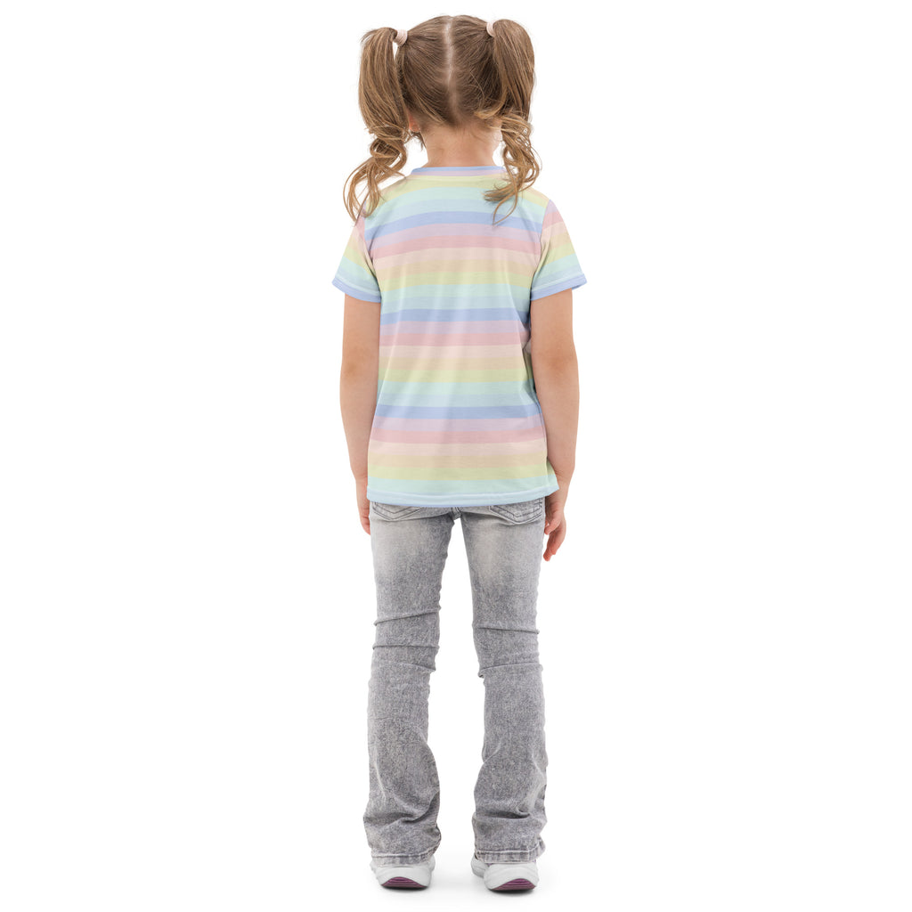 A child wearing a girls pastel rainbow stripes cotton t-shirt with soft pastel colors and faded gray flared jeans