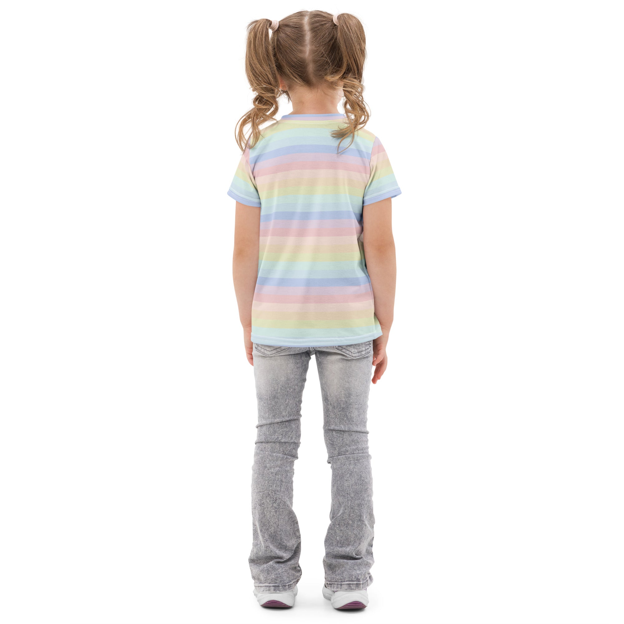 A child wearing a girls pastel rainbow stripes cotton t-shirt with soft pastel colors and faded gray flared jeans