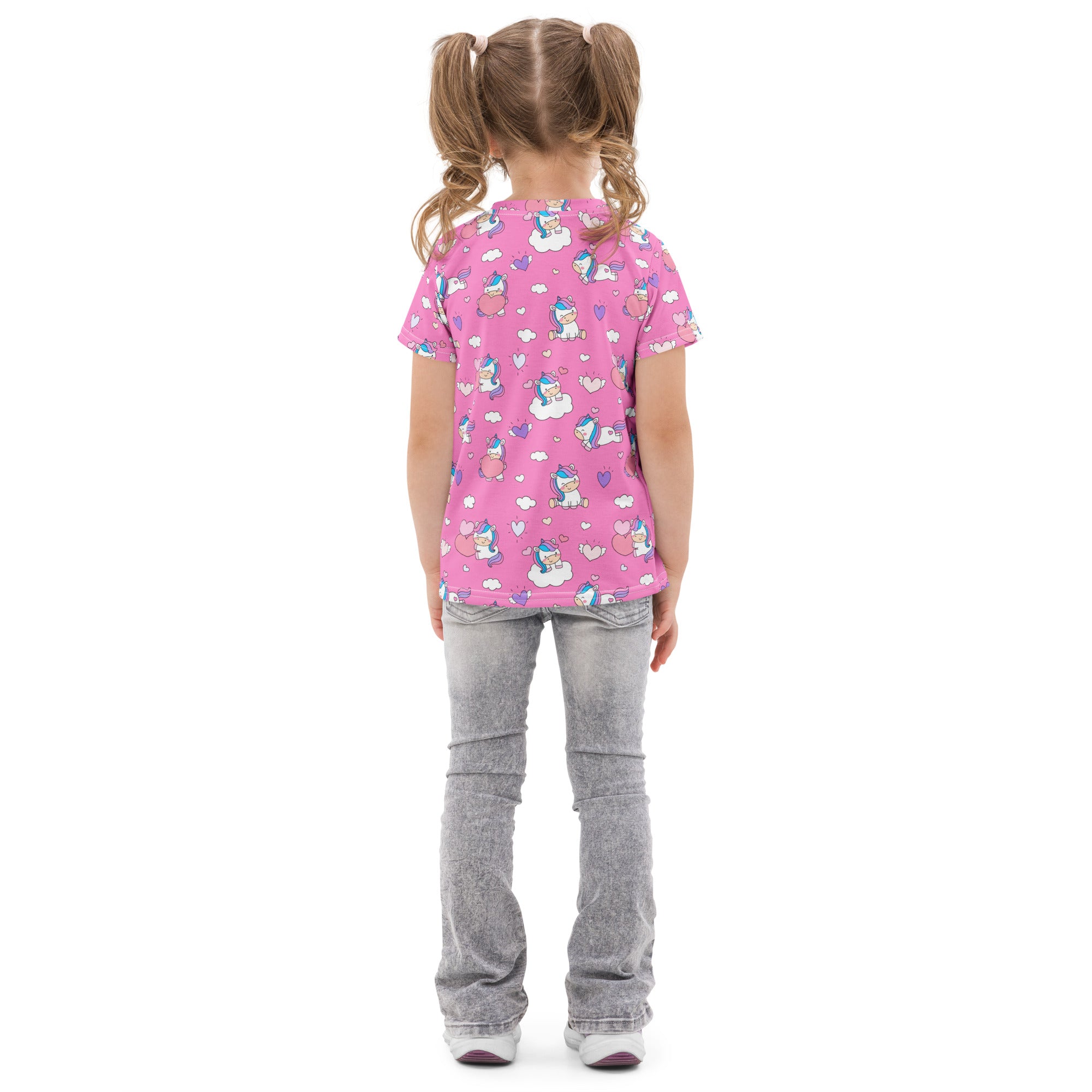 Girls unicorn hearts cotton t-shirt in pink with short sleeves and a playful cartoon unicorns clouds and hearts pattern