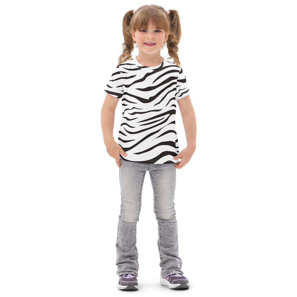 A child wearing a kids zebra print cotton t-shirt in black and white paired with light gray jeans