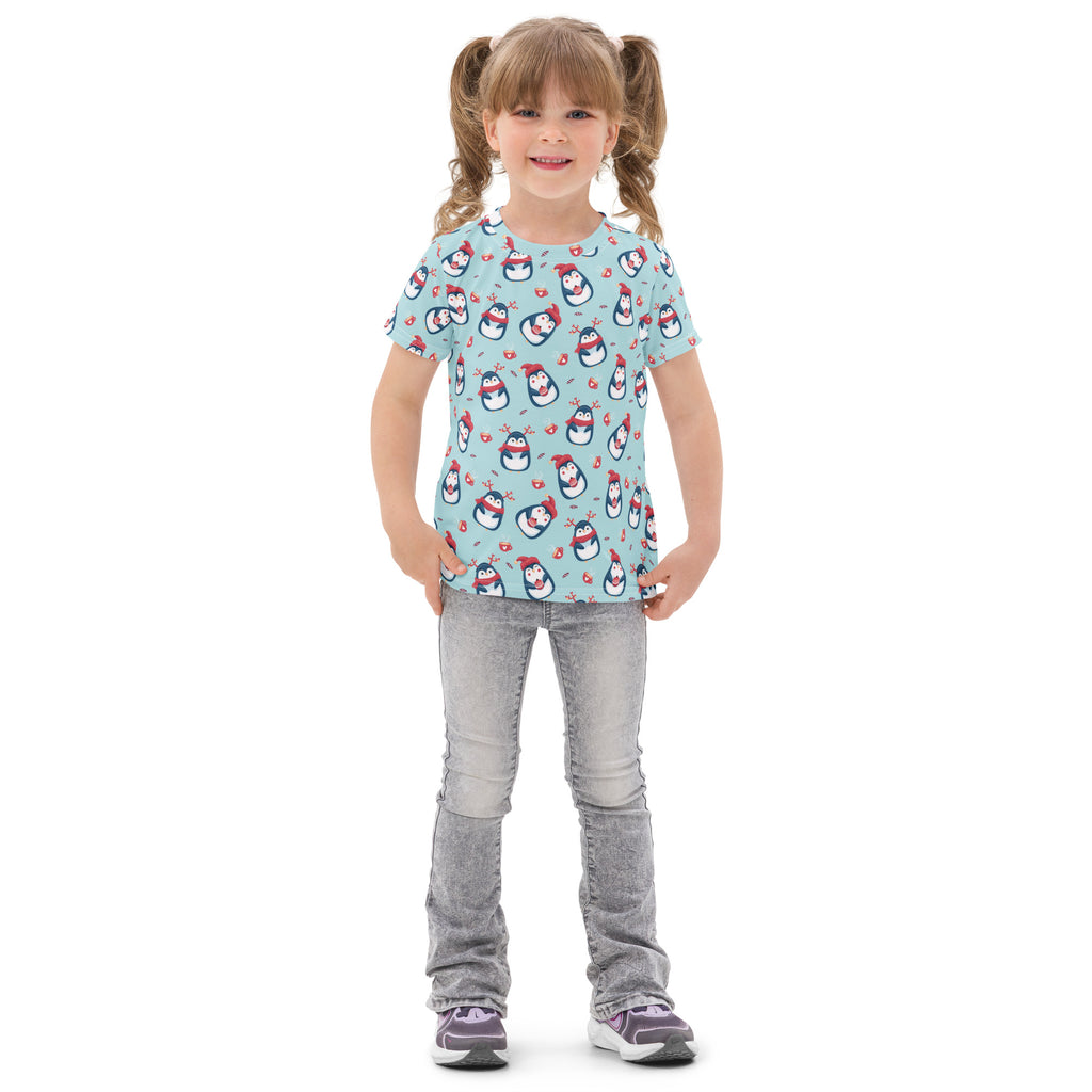 Light blue kids cotton t-shirt with playful cartoon penguins wearing red hats and scarves for christmas wear