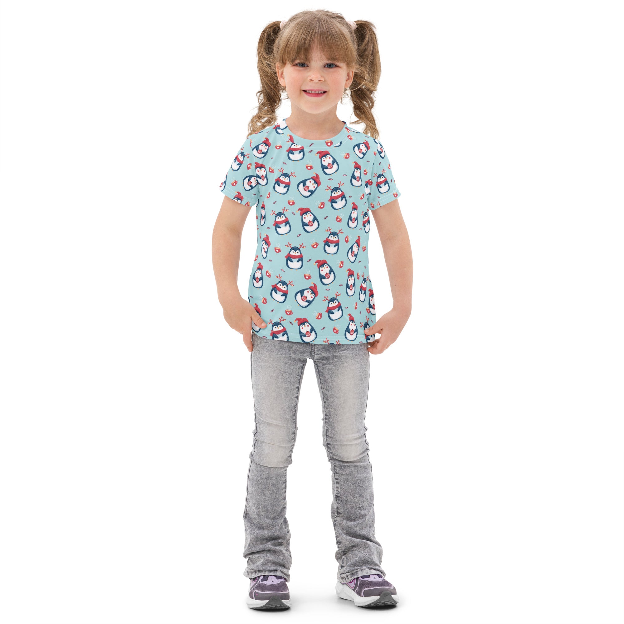 Light blue kids cotton t-shirt with playful cartoon penguins wearing red hats and scarves for christmas wear