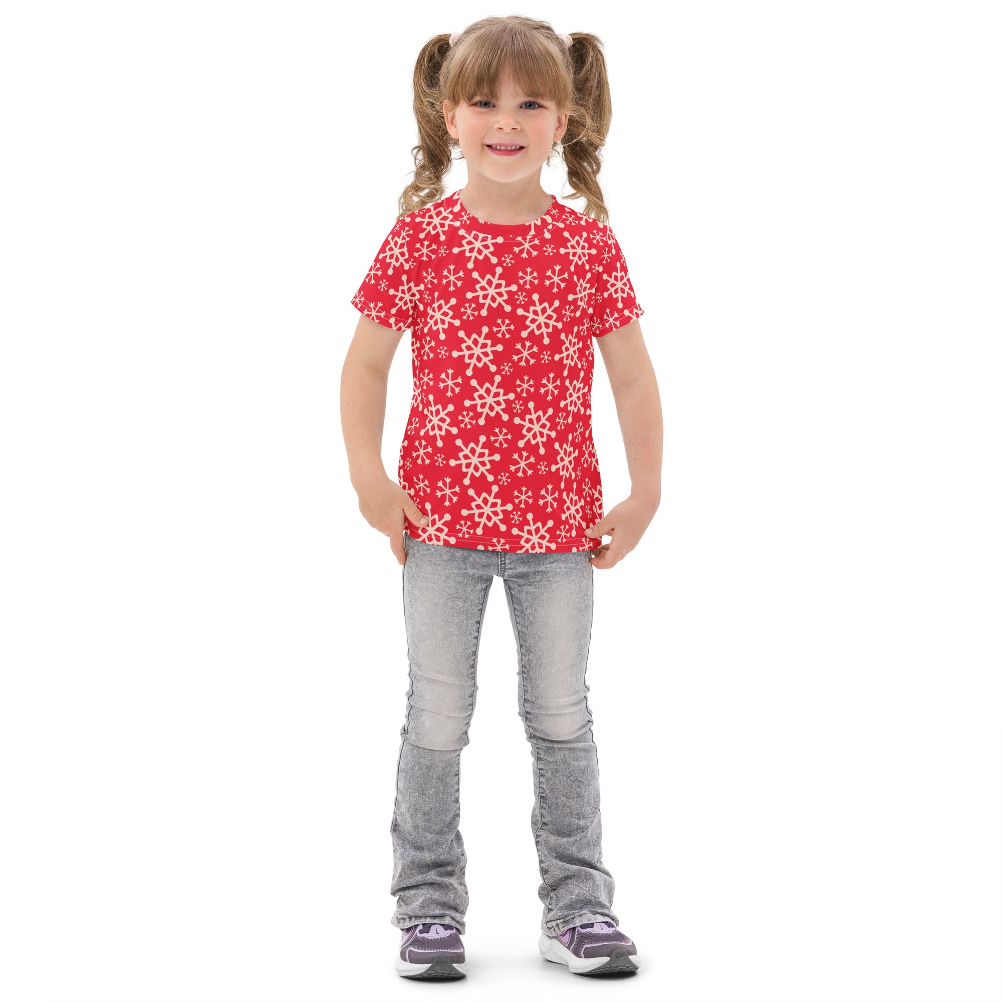 Kids red snowflakes christmas cotton t shirt featuring a white snowflake pattern on a red short sleeved fabric