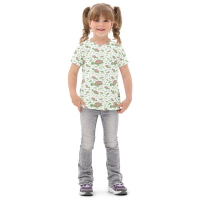 Kids green sea turtles cotton t-shirt with short sleeves and playful cartoon turtle pattern on a minty background