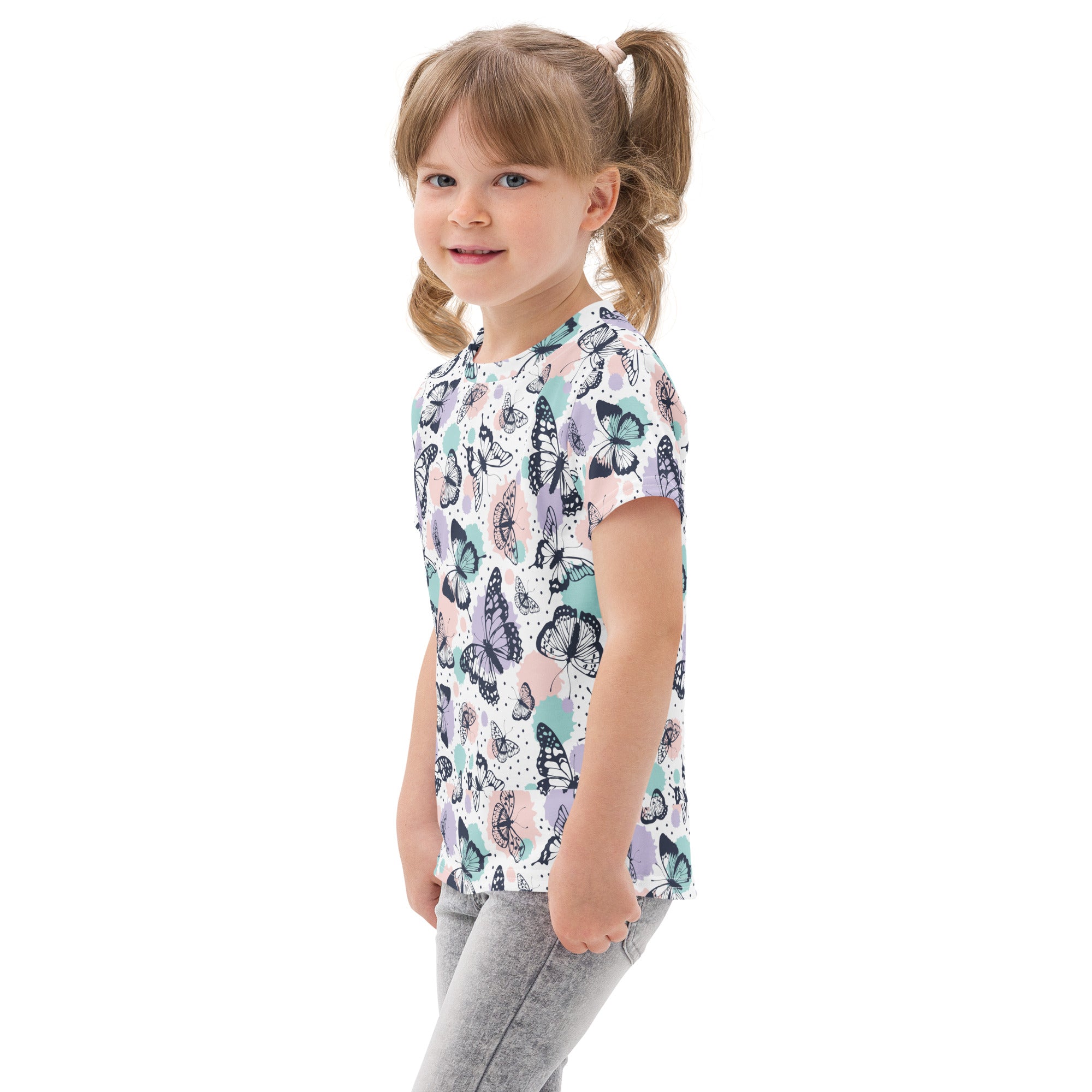 Kids pastel butterfly garden cotton t-shirt with short sleeves and playful butterfly pattern in soft pastel shades on light background