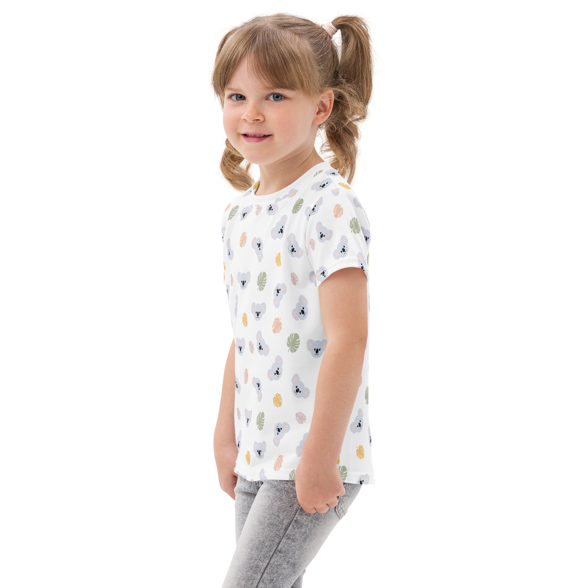 White kids koala cotton t-shirt with short sleeves featuring a playful koala and leaves pattern in soft pastels