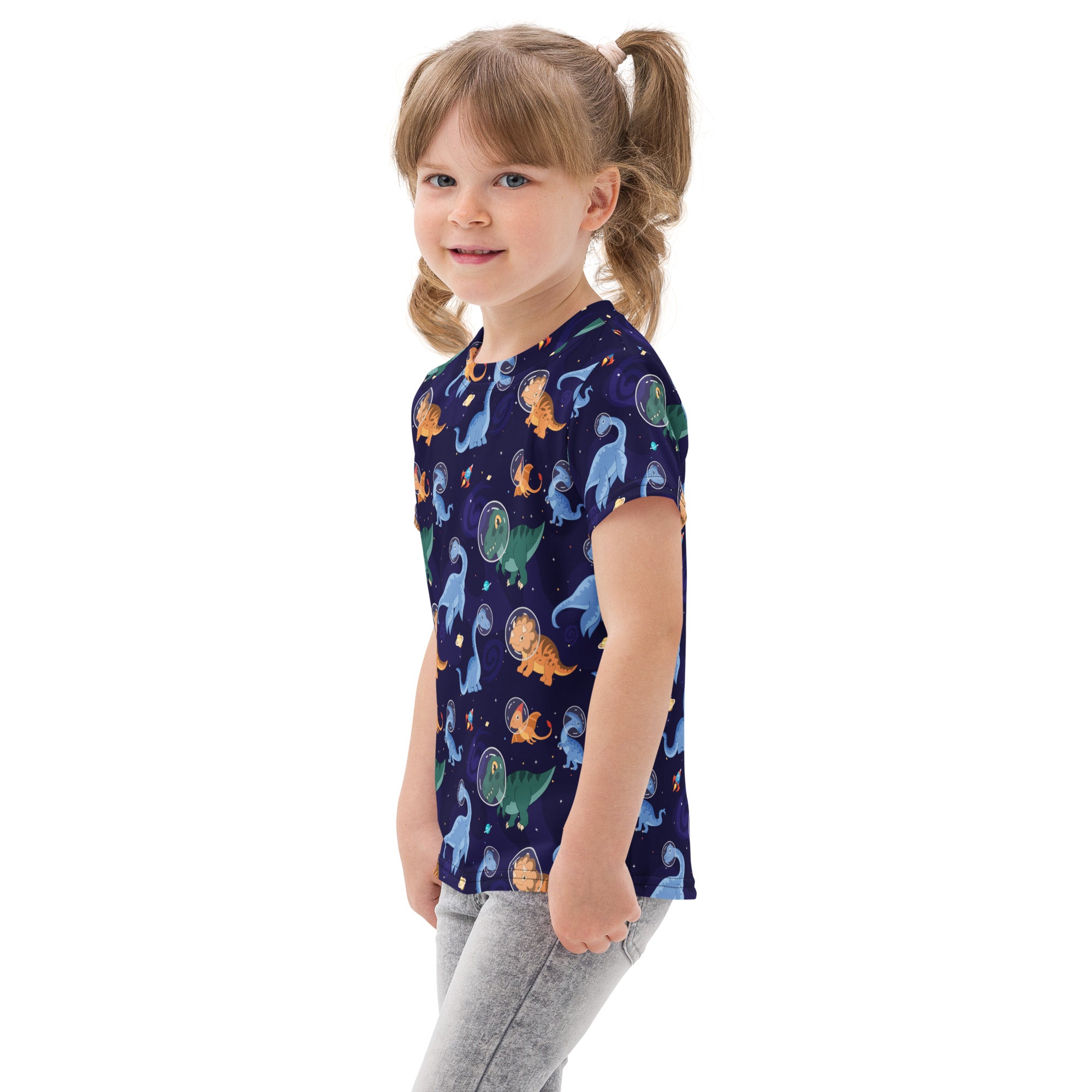 Navy blue cotton kids t-shirt with colorful cartoon dinosaurs on a starry space background