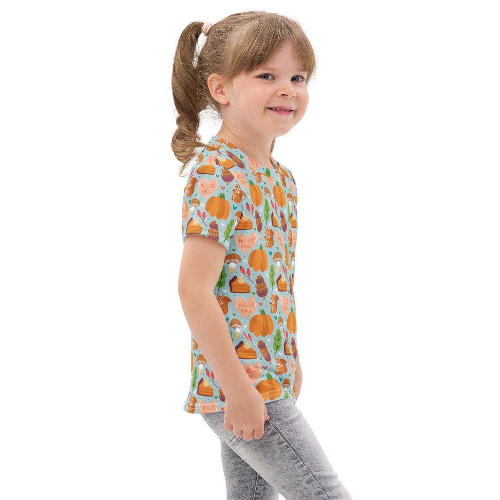 A child wearing a light blue cotton kids hello fall pumpkin t-shirt with pumpkins pies and leaves pattern