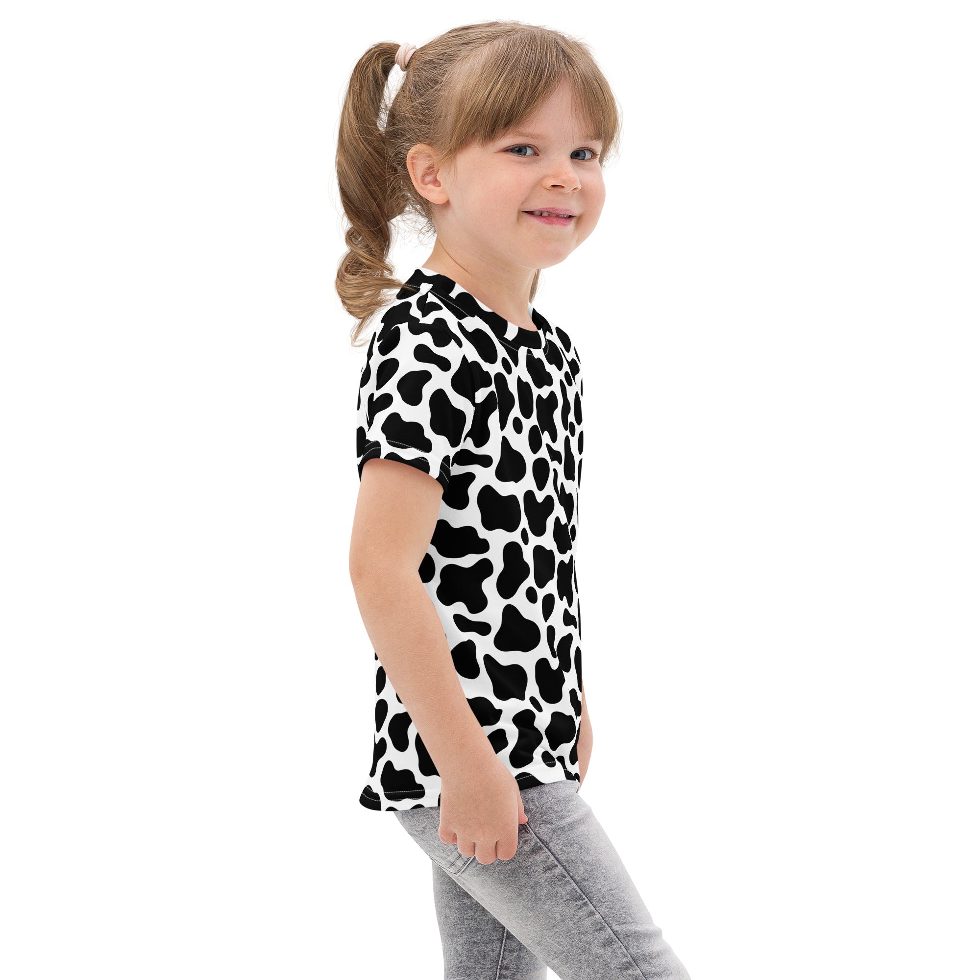 Kids black and white cow print short-sleeved cotton t-shirt featuring a playful monochrome pattern