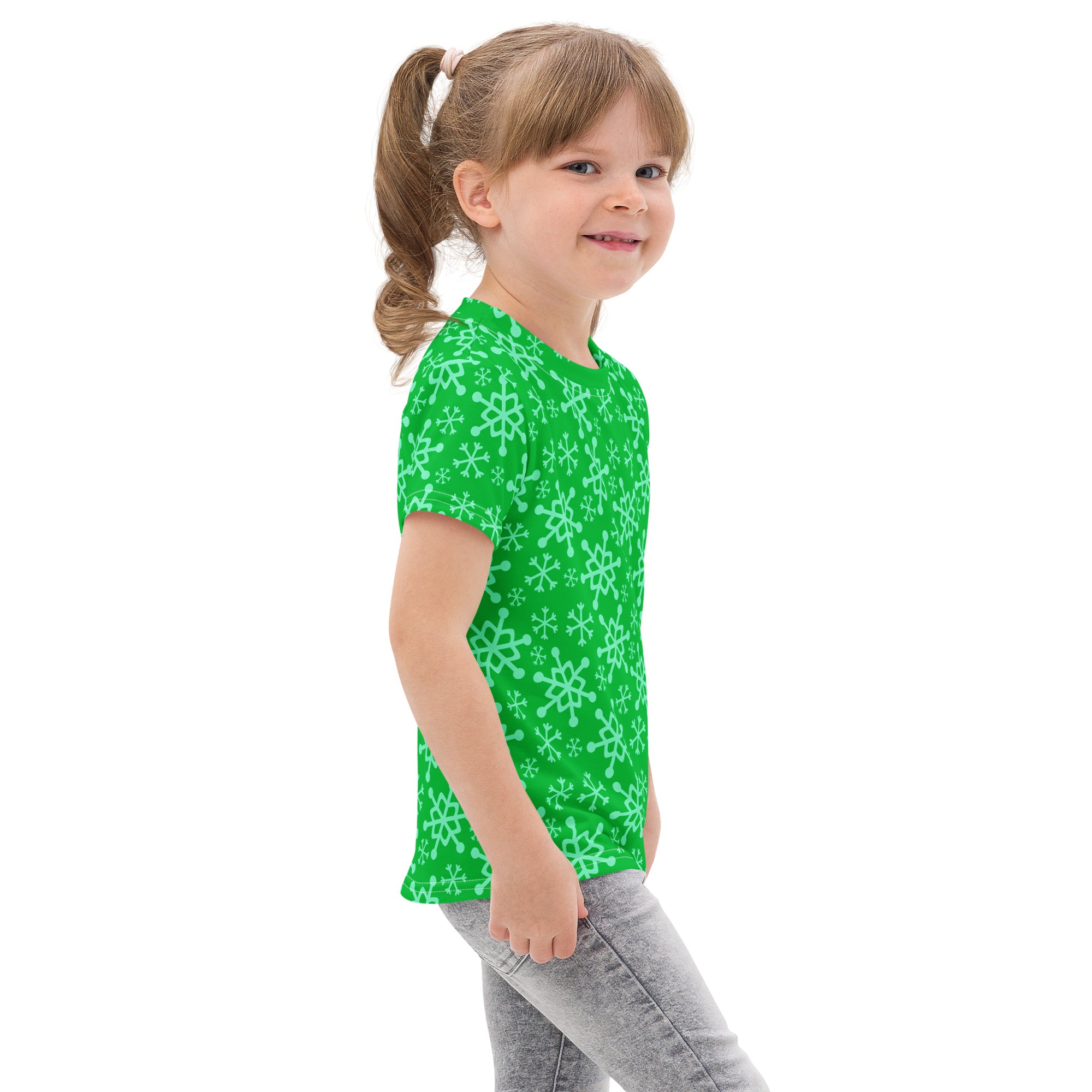 Kids green snowflakes christmas cotton t-shirt featuring bright green short sleeves and light mint snowflake pattern