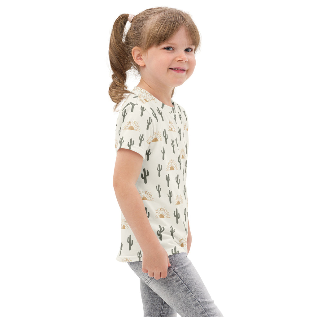 Kids cactus desert sunrise cotton t-shirt with black cacti and gold sunburst pattern on off-white short sleeves