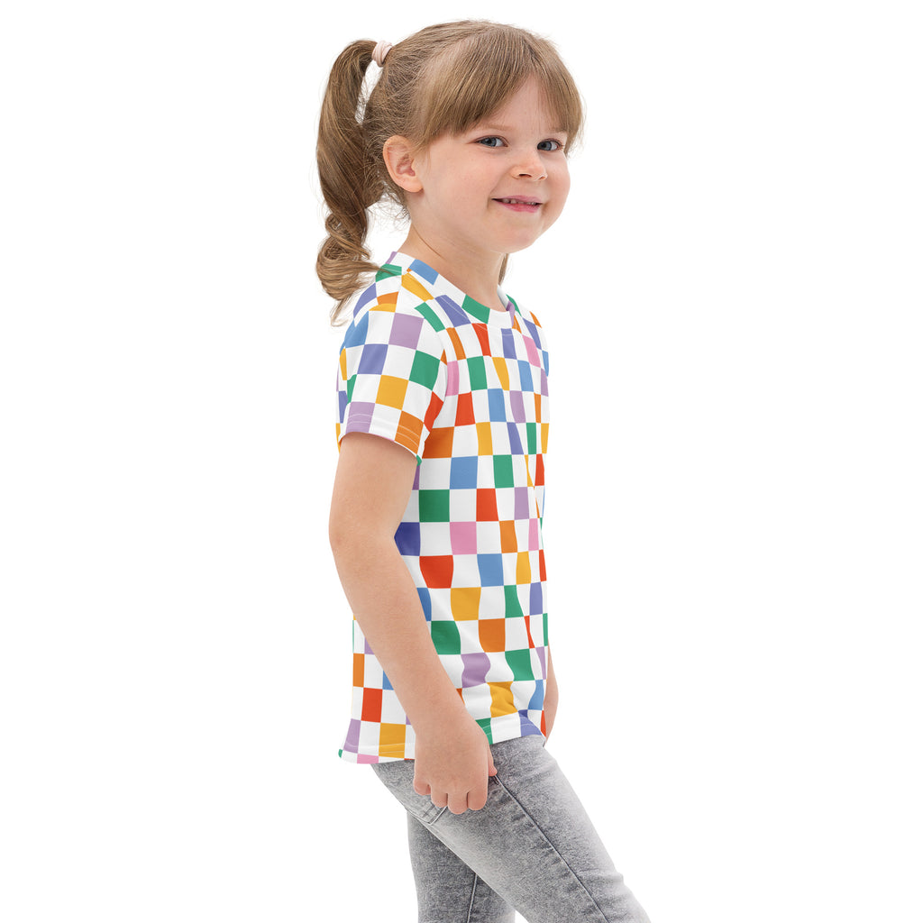 A child wearing a kids rainbow checkerboard cotton t-shirt with colorful checkered short sleeves