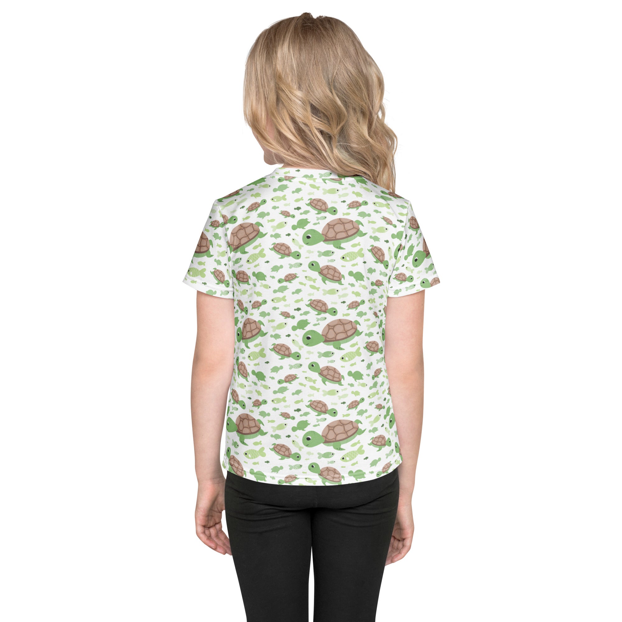 Kids green sea turtles t-shirt is a white short-sleeved shirt with a playful pattern of green and brown turtles