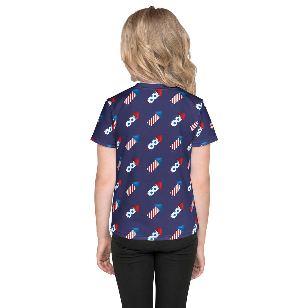 Navy blue kids firework rockets t-shirt with short sleeves and a repeating red white and blue fireworks pattern