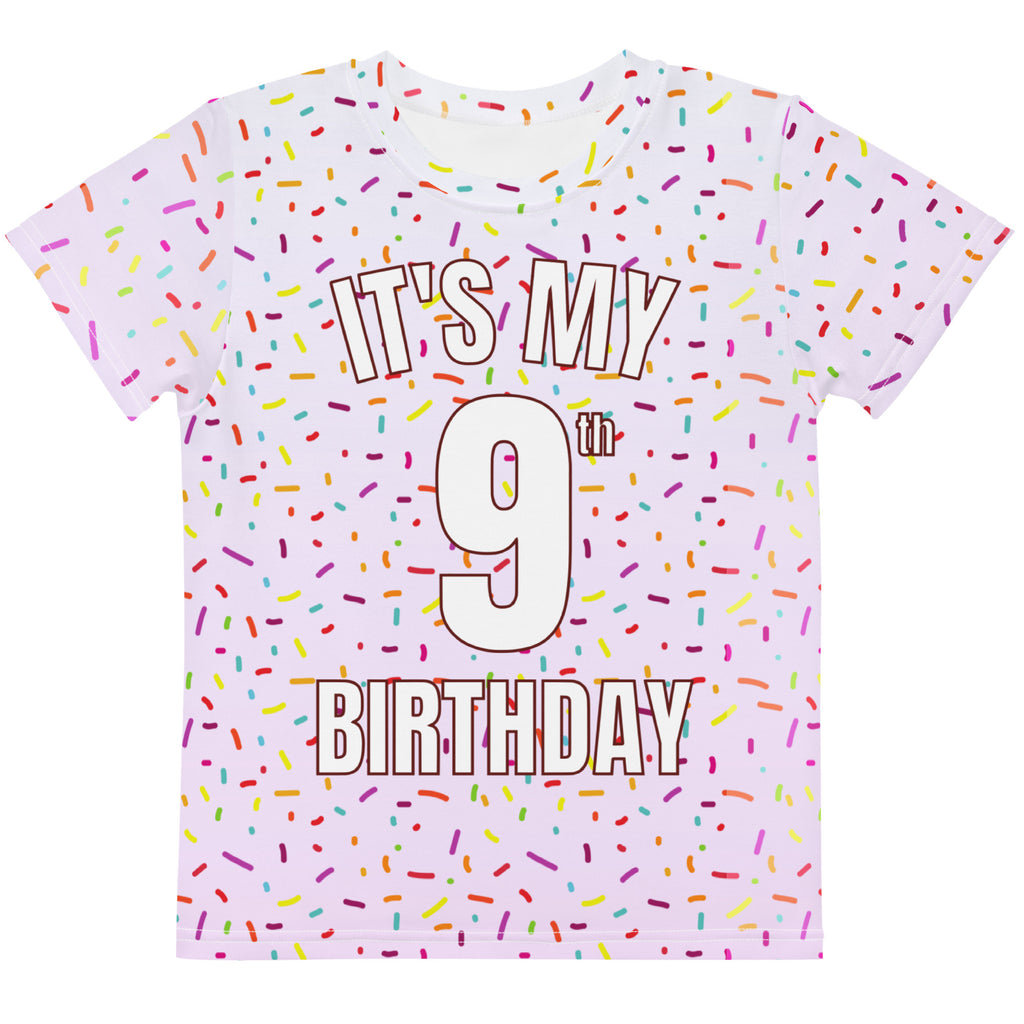A pink short-sleeved girls t-shirt with colorful sprinkles and it is my 9th birthday text in bold white letters