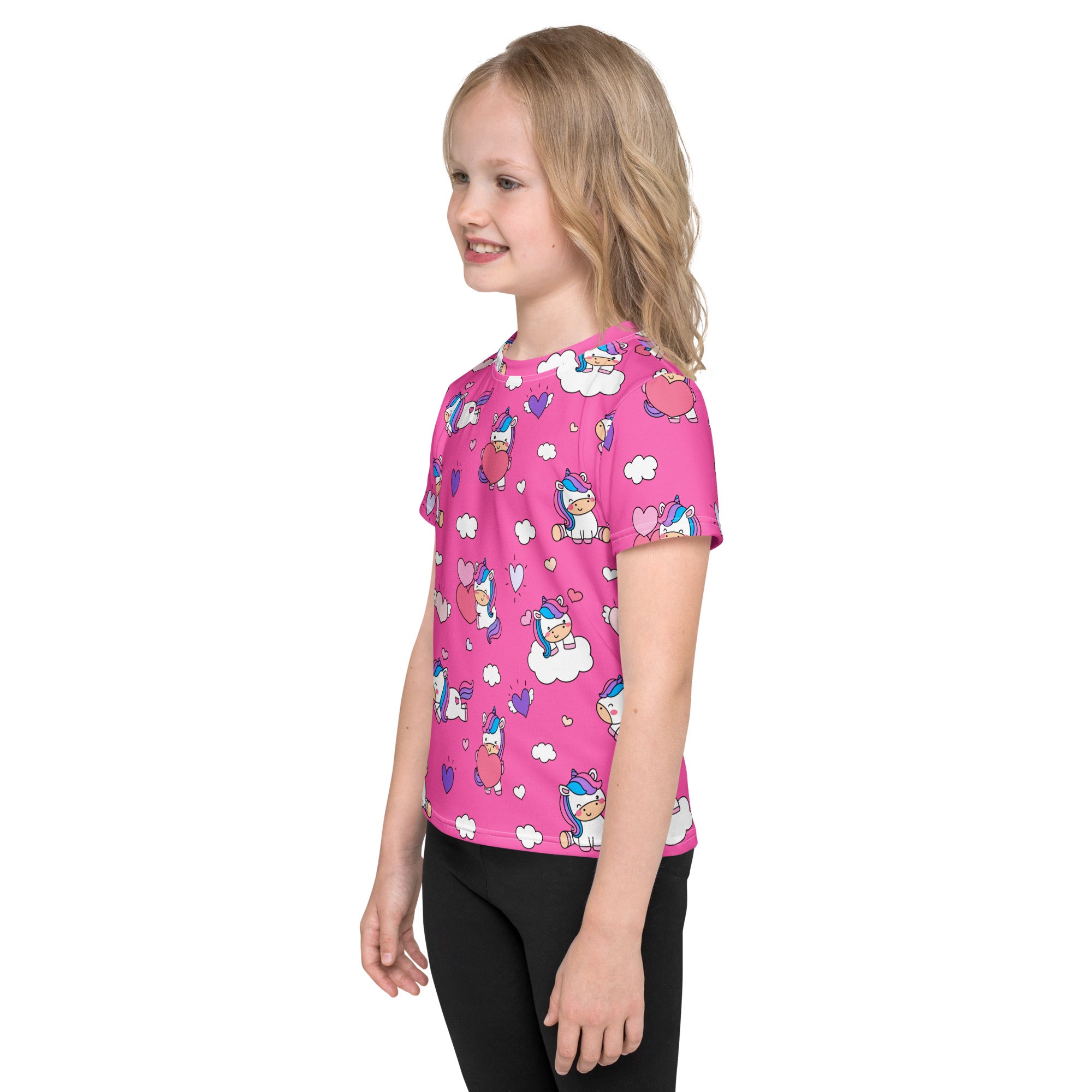 Girls pink short-sleeved t-shirt with playful white and blue cartoon unicorns hearts and clouds pattern