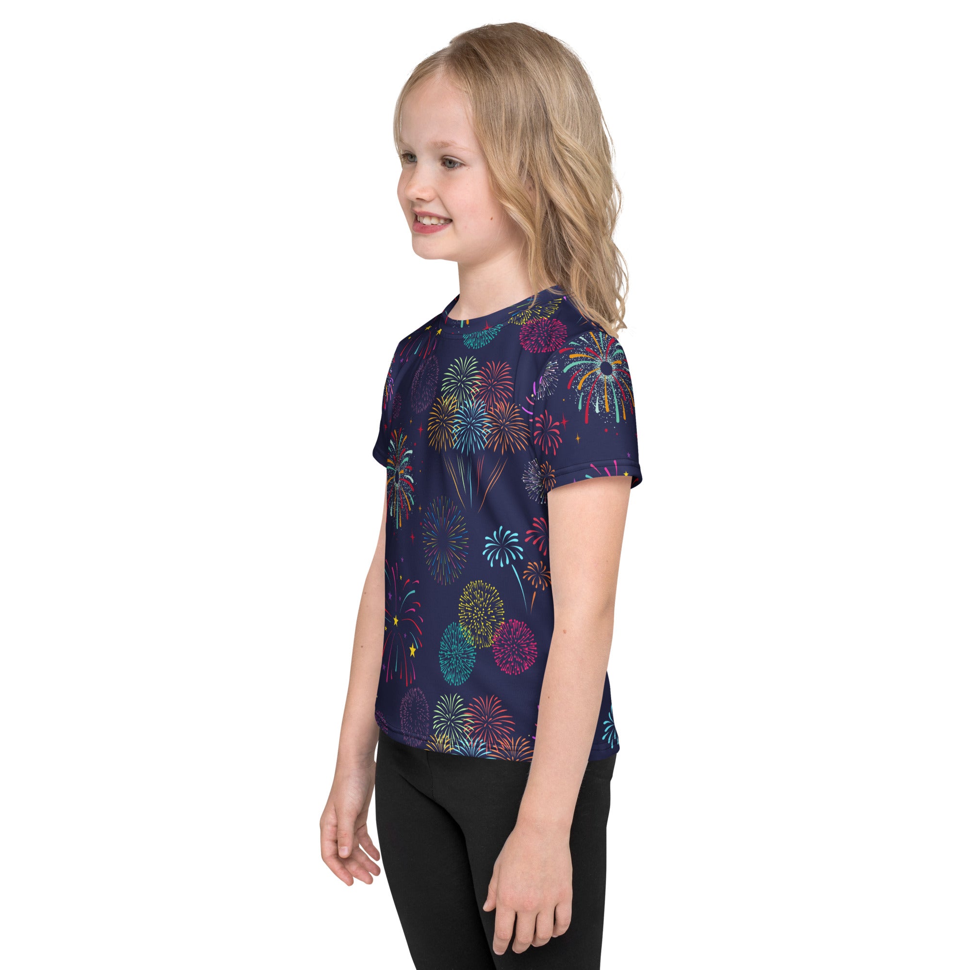 A navy blue kids short-sleeved t-shirt with a vibrant colorful fireworks all-over print in pink teal yellow and purple