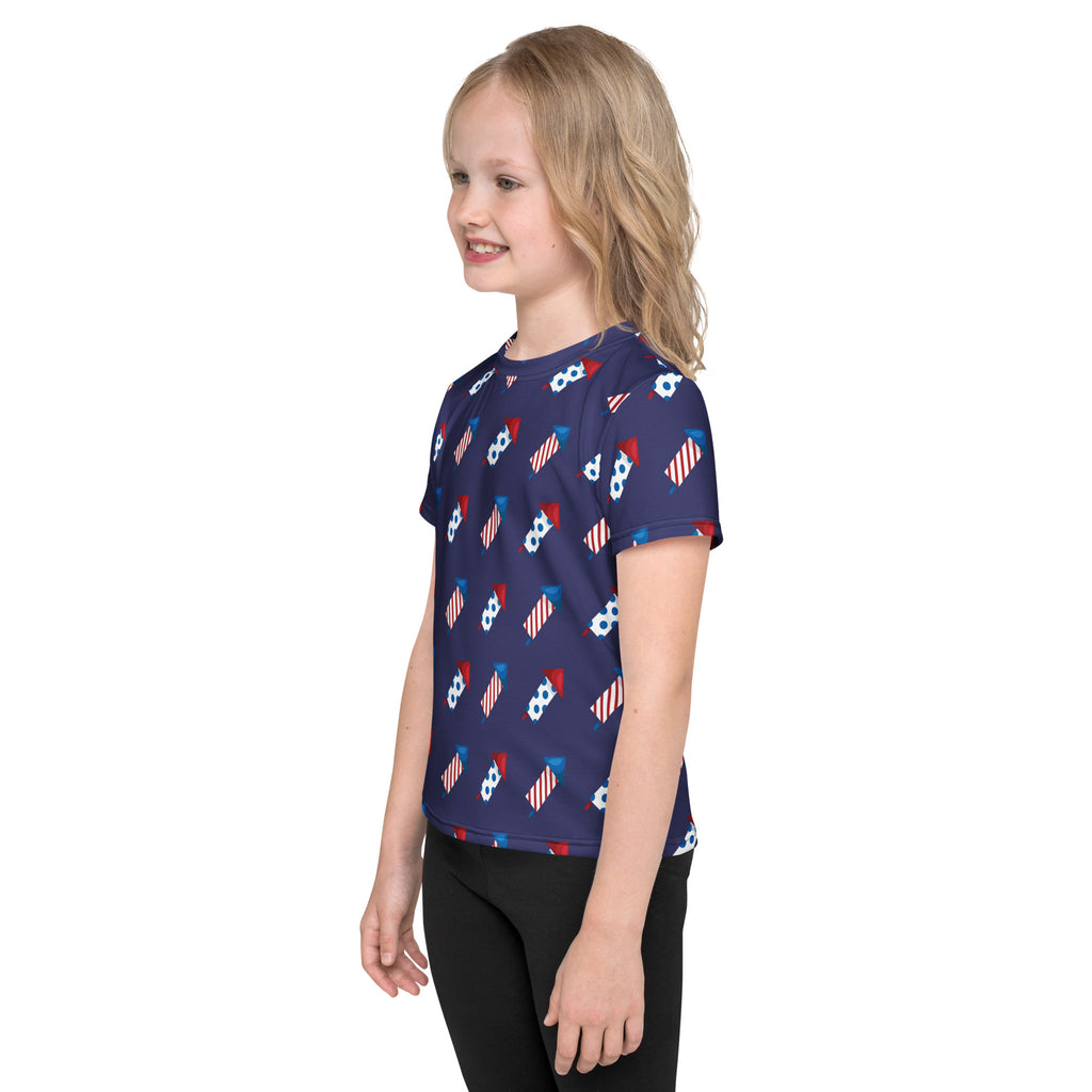 Navy blue kids firework rockets t-shirt with short sleeves featuring red white and blue fireworks and soccer balls pattern