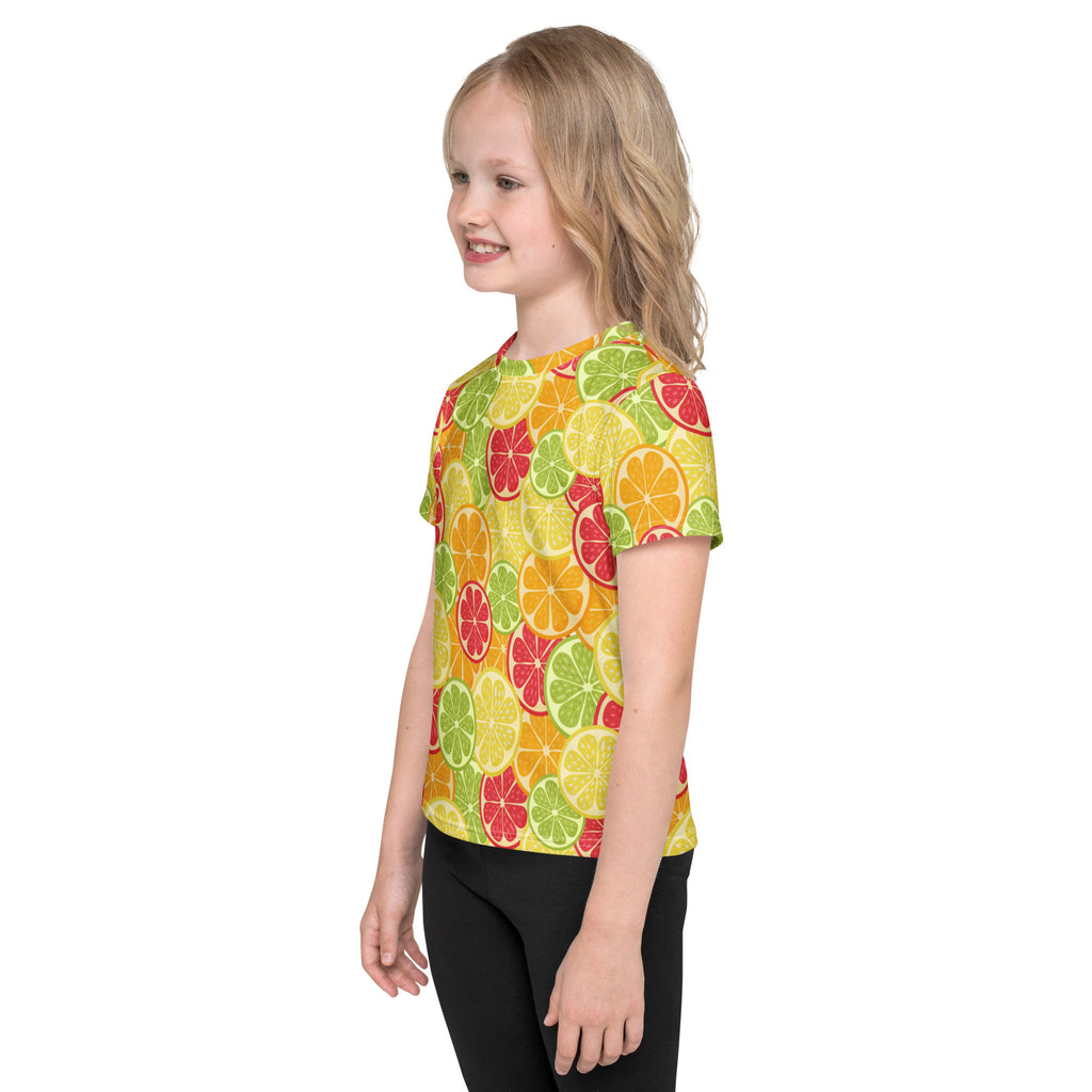 A vibrant yellow kids short-sleeved t-shirt with a lively pattern of red orange and green sliced citrus fruits