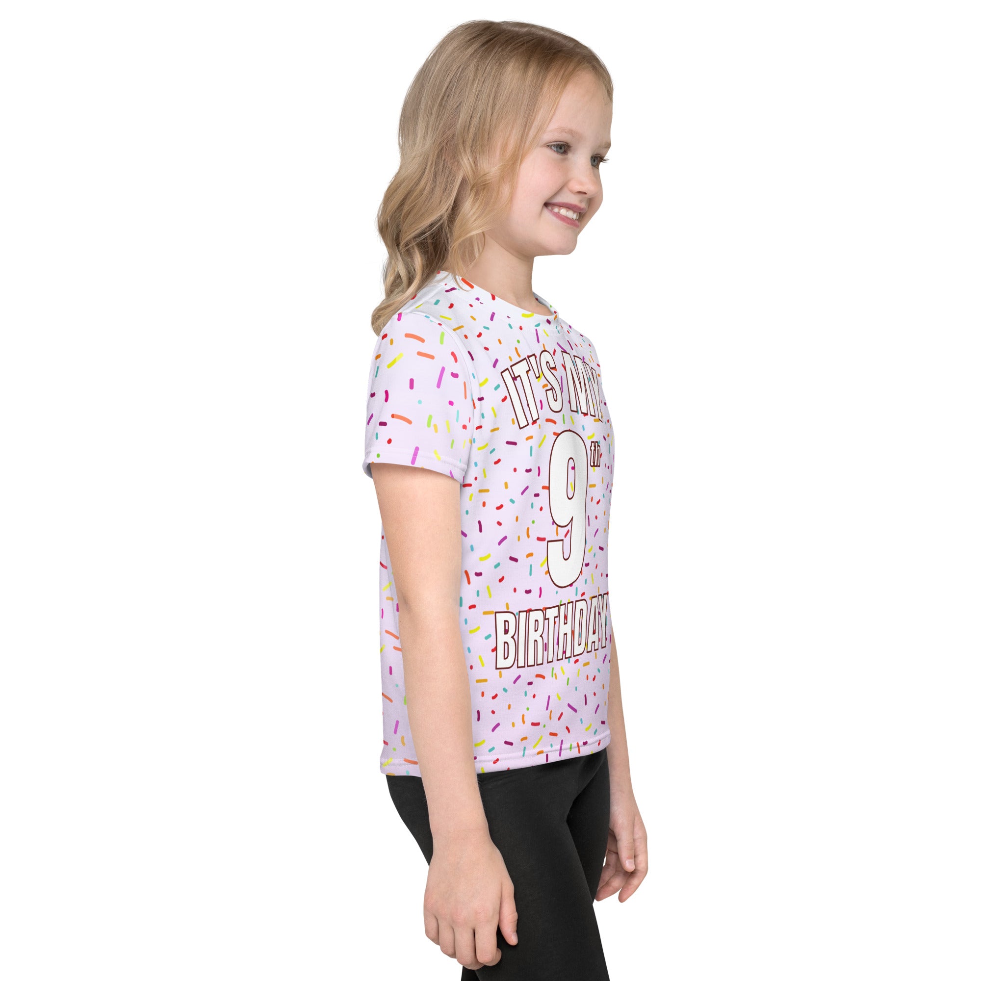 A white short-sleeved girls t-shirt with colorful sprinkle print and bold its my 9th birthday text for celebrations