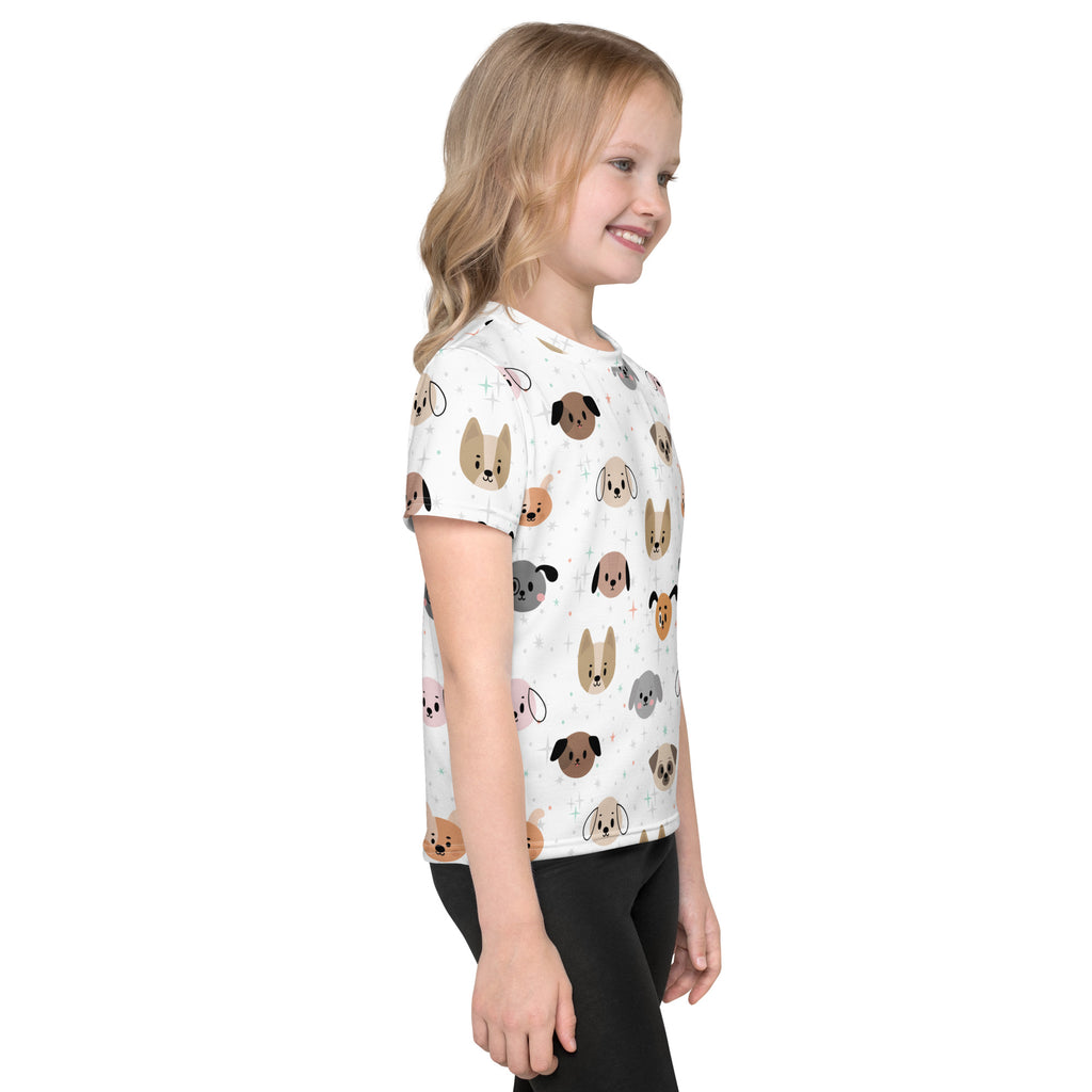 White short-sleeved kids t-shirt with playful multicolored cartoon dog faces pattern perfect for casual wear