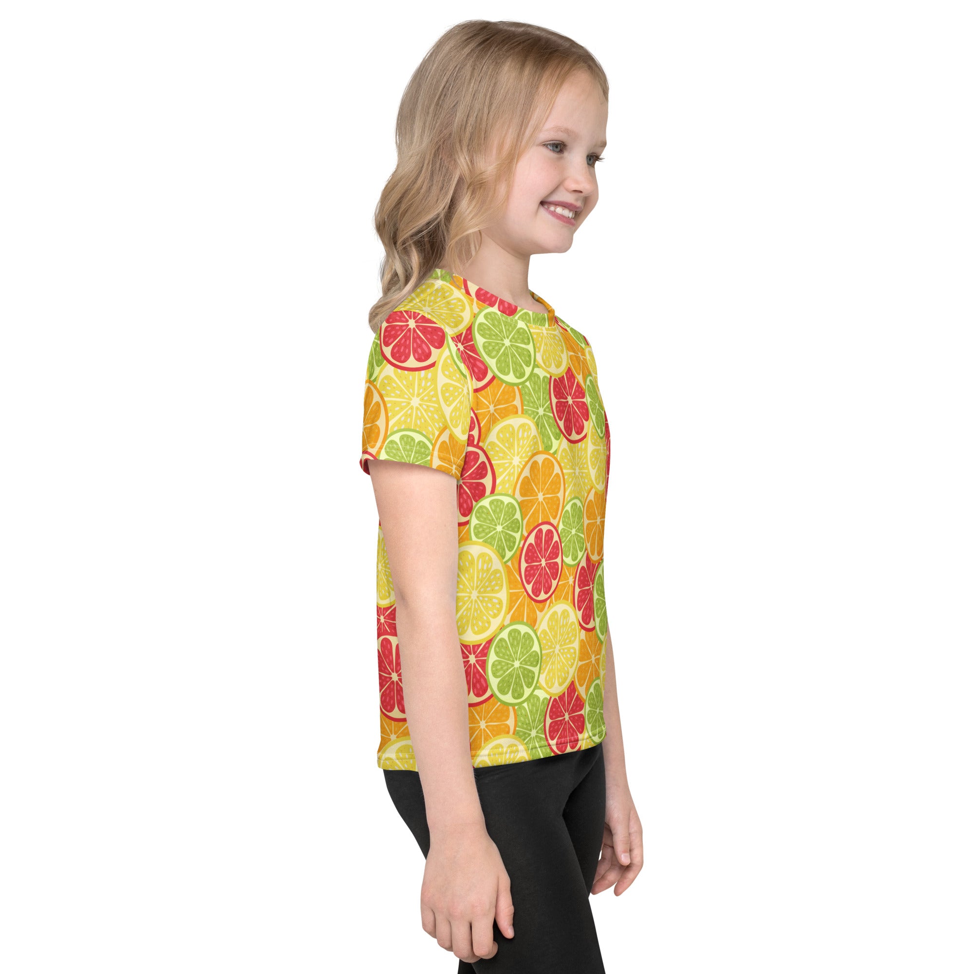 A vibrant yellow kids short-sleeved t-shirt with playful red green and orange sliced citrus fruit pattern