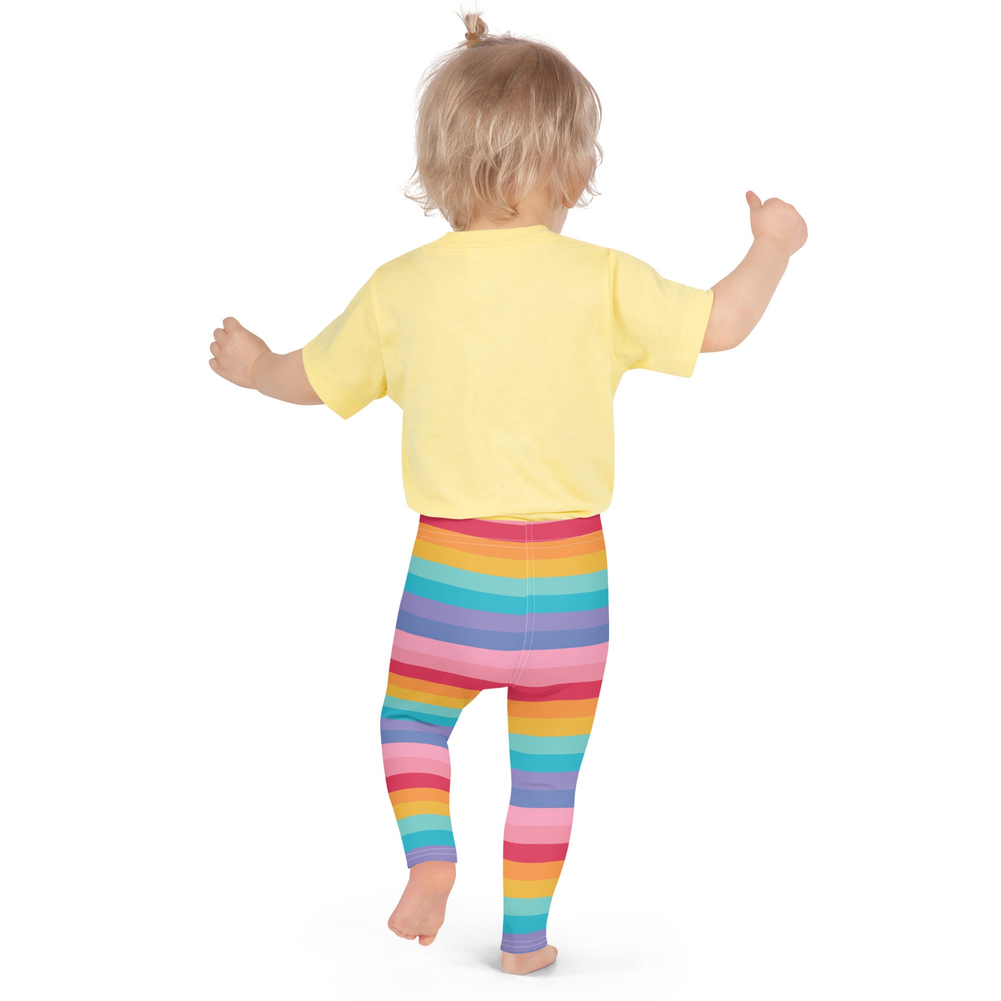 Girls bright rainbow striped buttery soft leggings worn by a child showcasing colorful comfortable fit