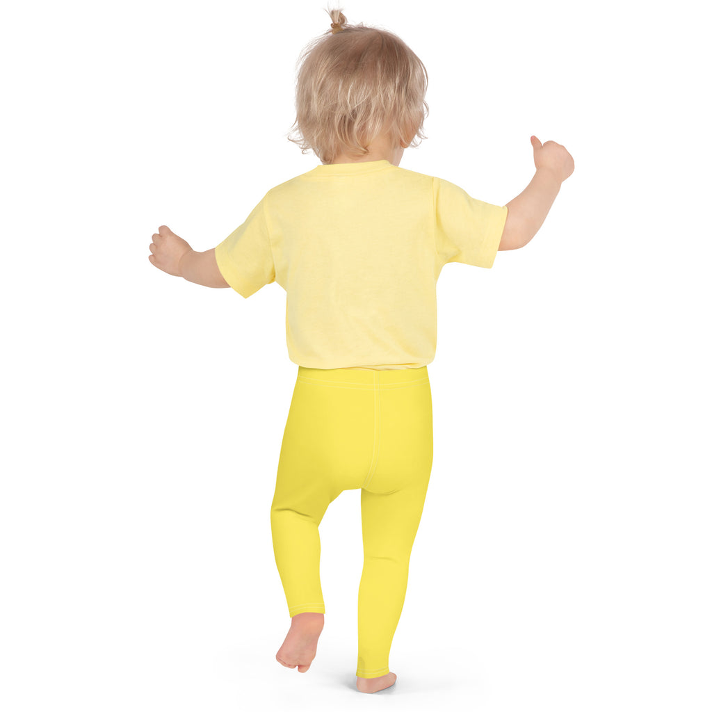 A toddler wearing bright yellow kids buttery soft leggings and matching short-sleeved top for comfortable wear
