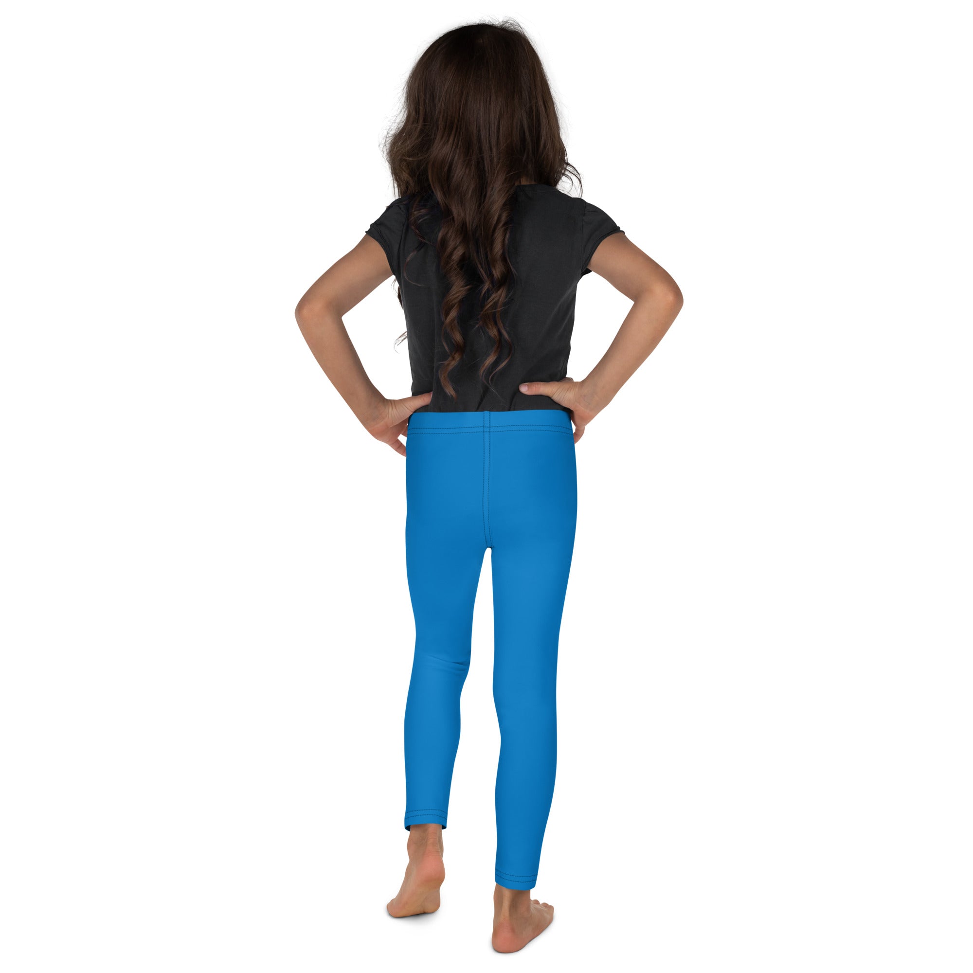 Kids buttery soft blue leggings in bright blue form-fitting fabric worn by a child for comfortable wear