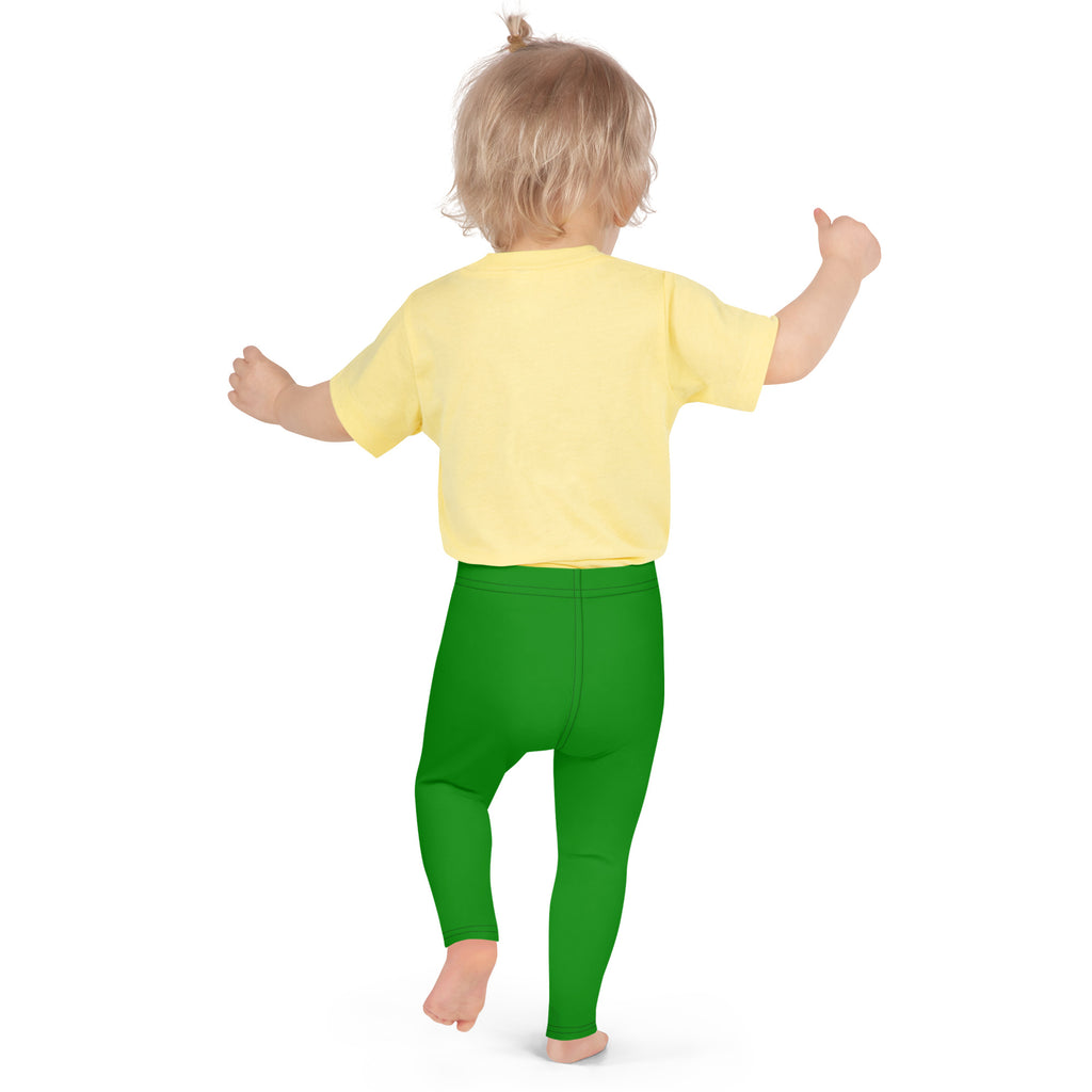 A toddler wearing kids buttery soft green leggings made of soft material paired with a bright yellow shirt