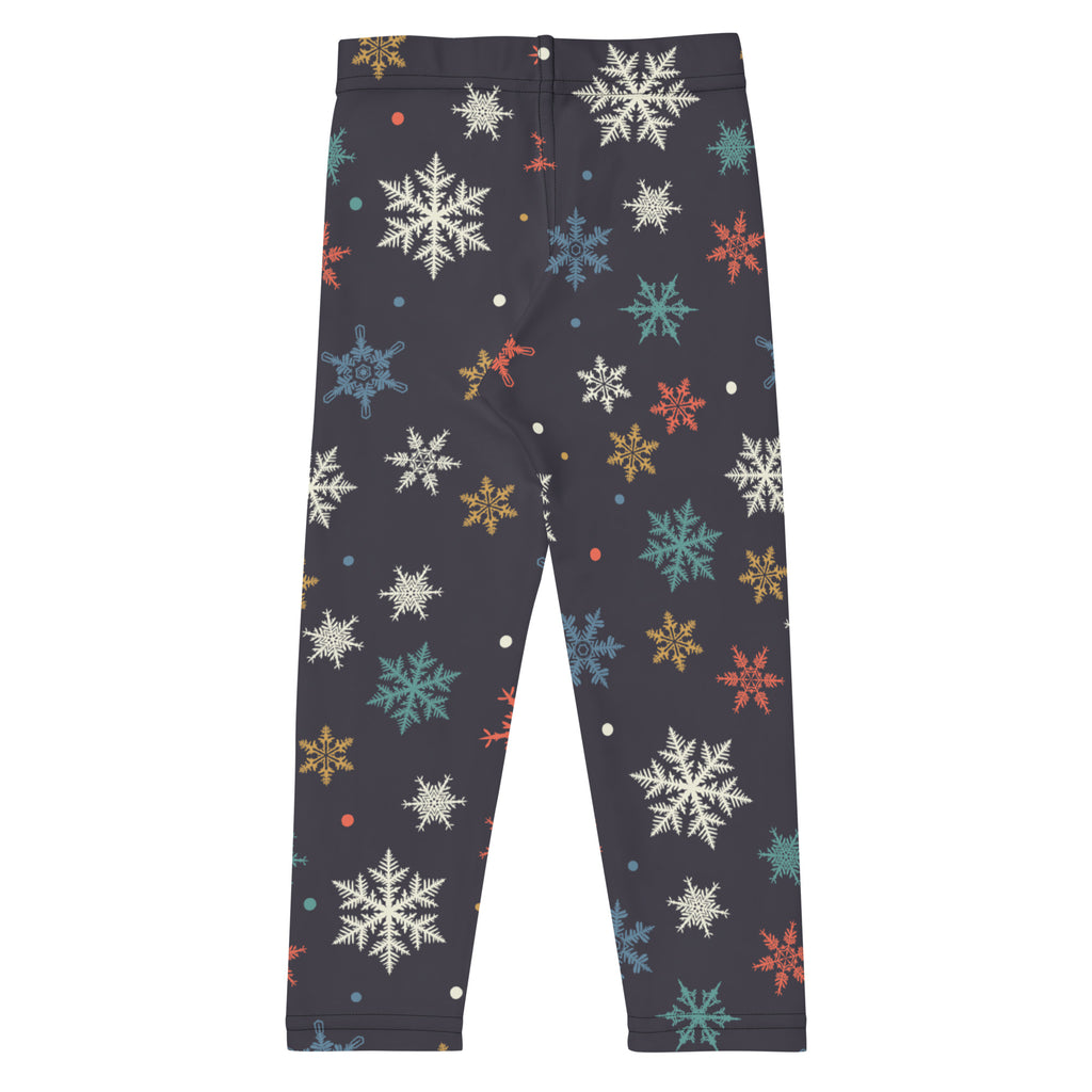 Dark gray kids christmas leggings with colorful white teal orange and gold snowflakes festive holiday pattern