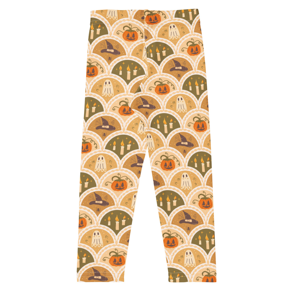 Kids autumn themed halloween buttery soft leggings in orange olive green and cream with pumpkins ghosts and witch hats pattern