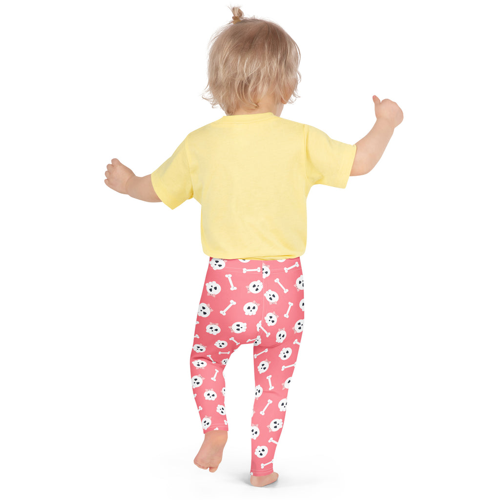 Girls pink buttery soft leggings with white skulls and bones playful pattern perfect for halloween wear