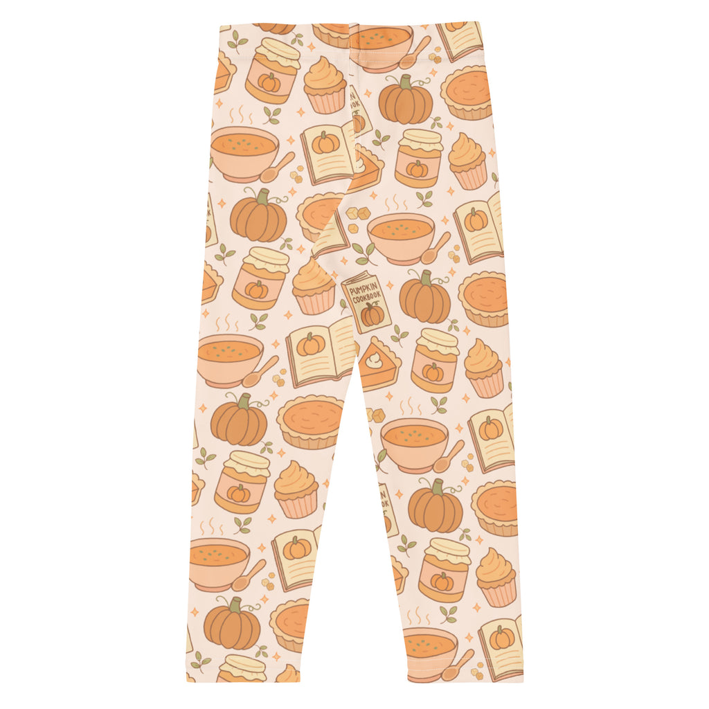 Kids pumpkin pie themed buttery soft leggings in warm orange and beige with pies soup cupcakes jars and a pumpkin cookbook design