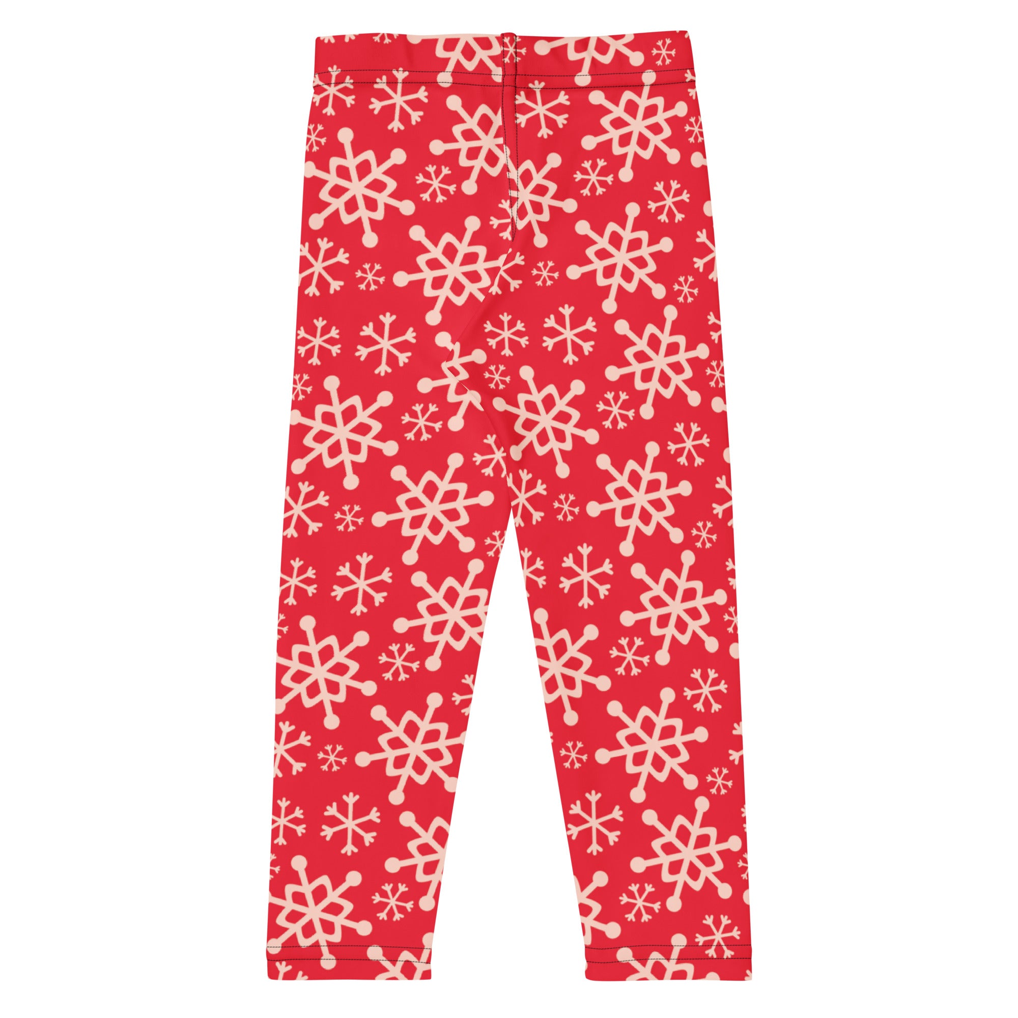 Kids red snowflake buttery soft leggings featuring a playful cream-colored snowflake pattern on red fabric