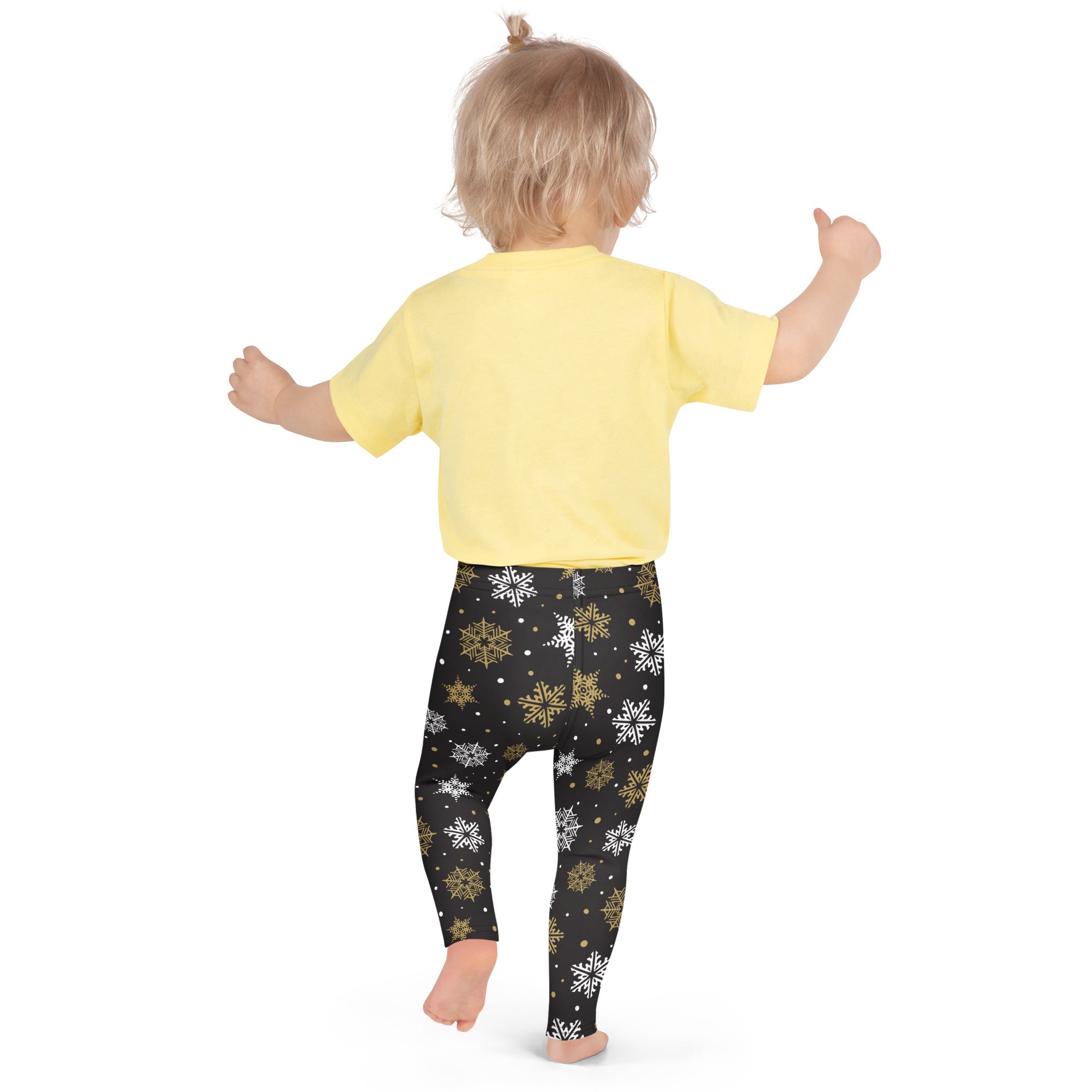 Kids gold and white snowflake buttery soft black leggings with white and gold snowflake patterns for winter wear