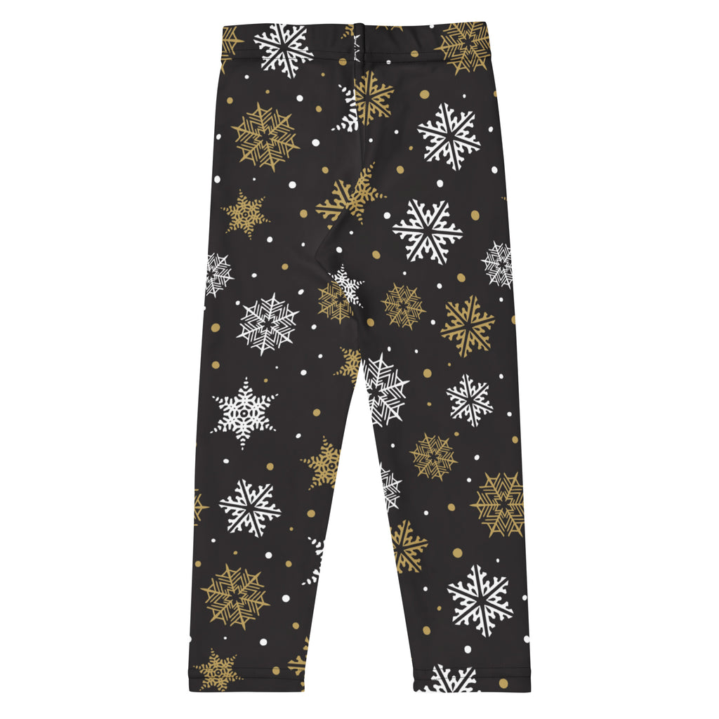 Kids gold and white snowflake buttery soft black leggings with festive snowflake pattern for winter wear