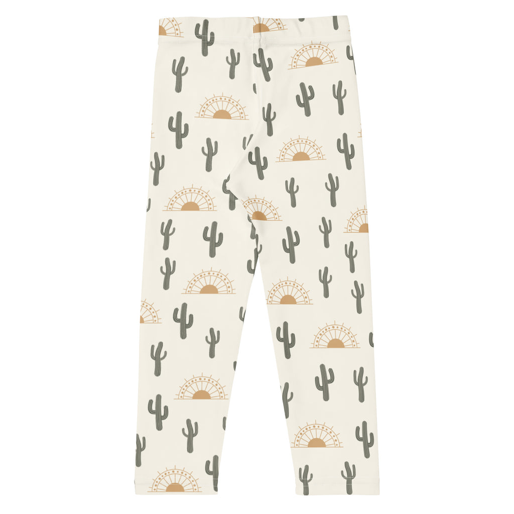 Kids cactus desert sunrise buttery soft cream-colored leggings with gray cactus and tan sun pattern