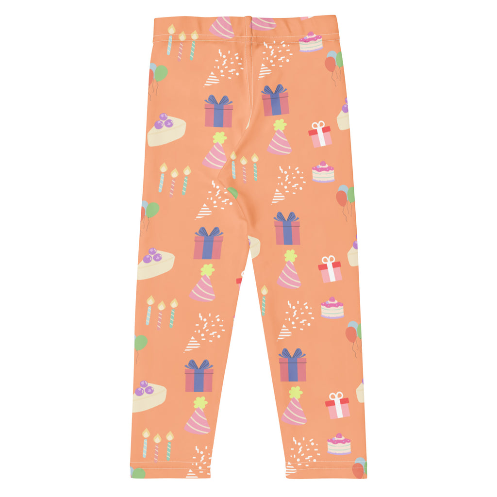 Kids orange birthday pattern buttery soft leggings with playful pastel cakes gifts hats and balloons illustrations