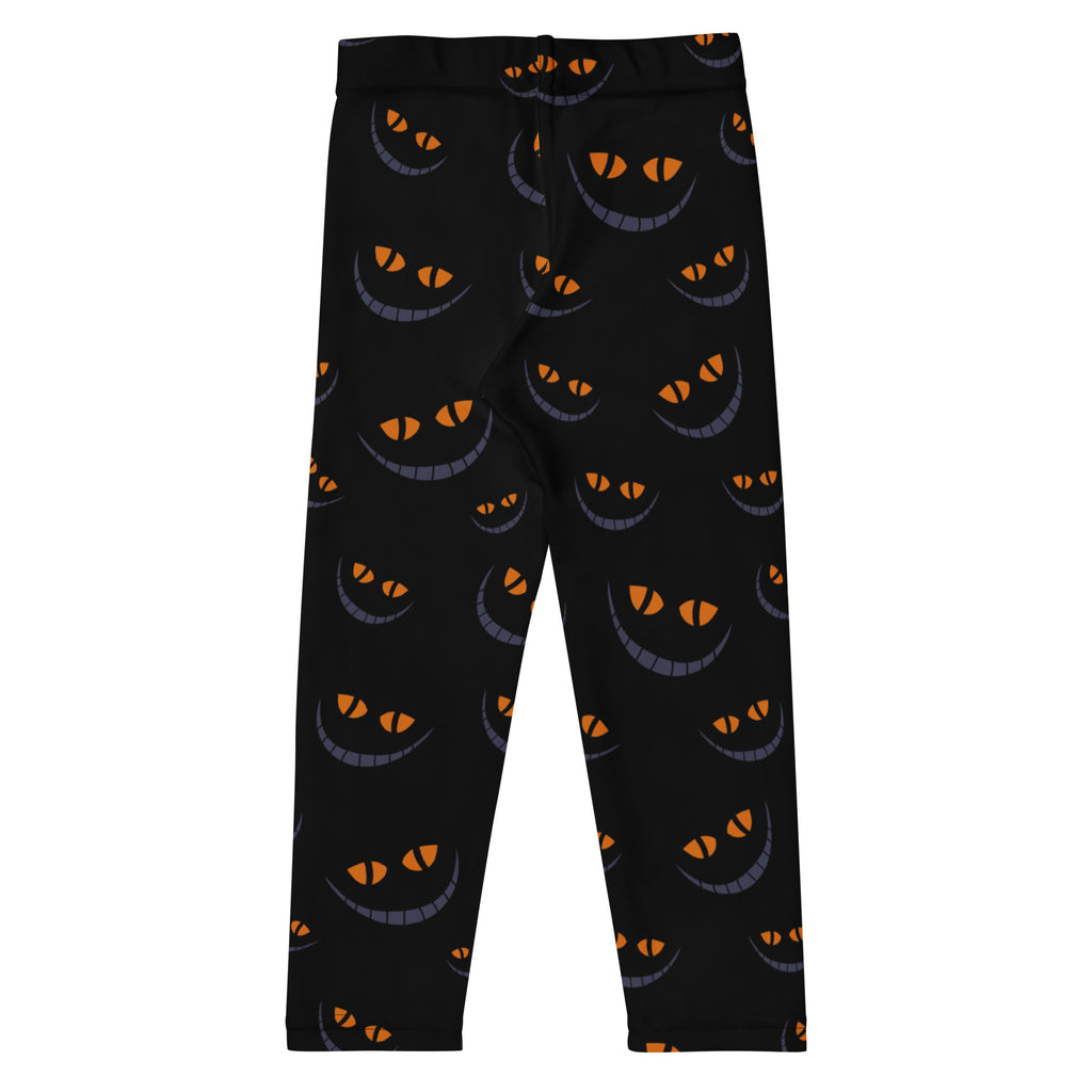Kids halloween grinning cat buttery soft black leggings with playful orange and gray smiling cat face pattern
