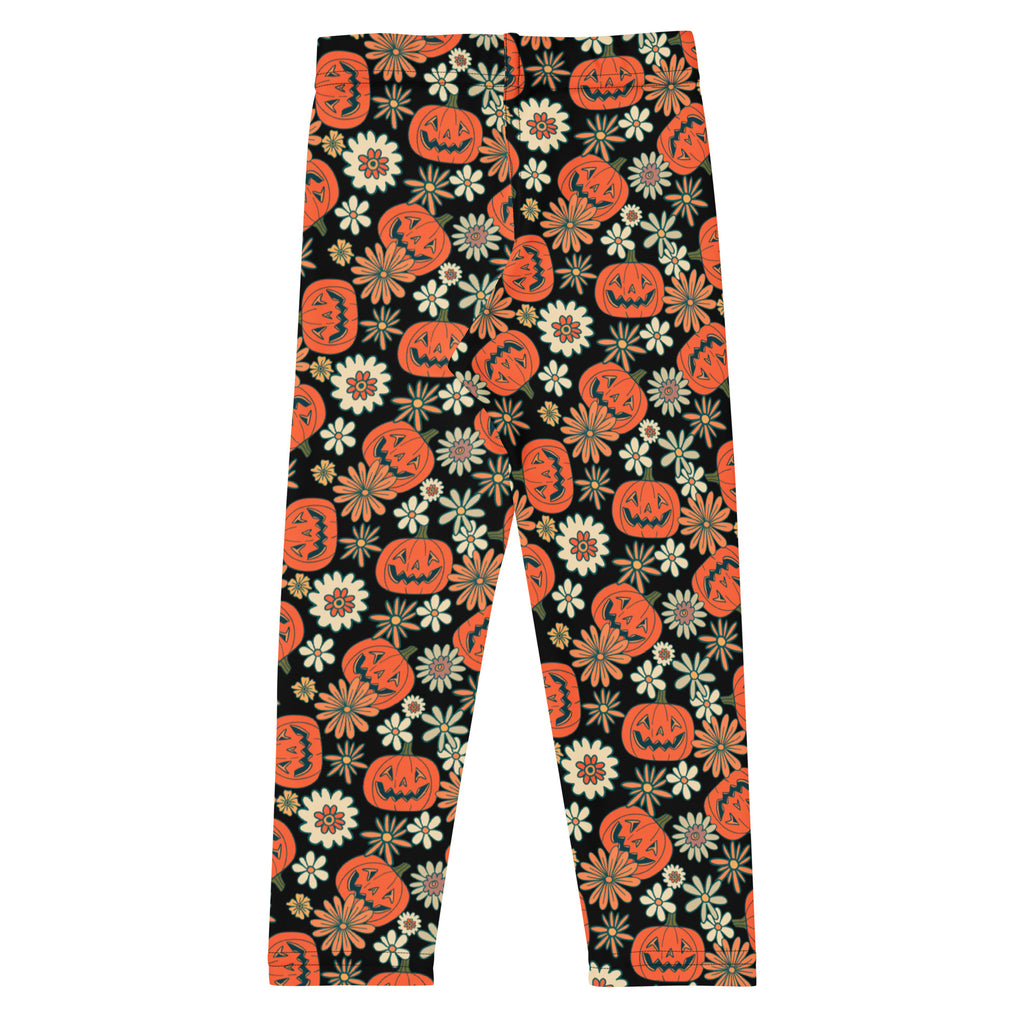 Kids vintage halloween pumpkin floral buttery soft black leggings with vibrant orange jack-o’-lanterns and white flowers