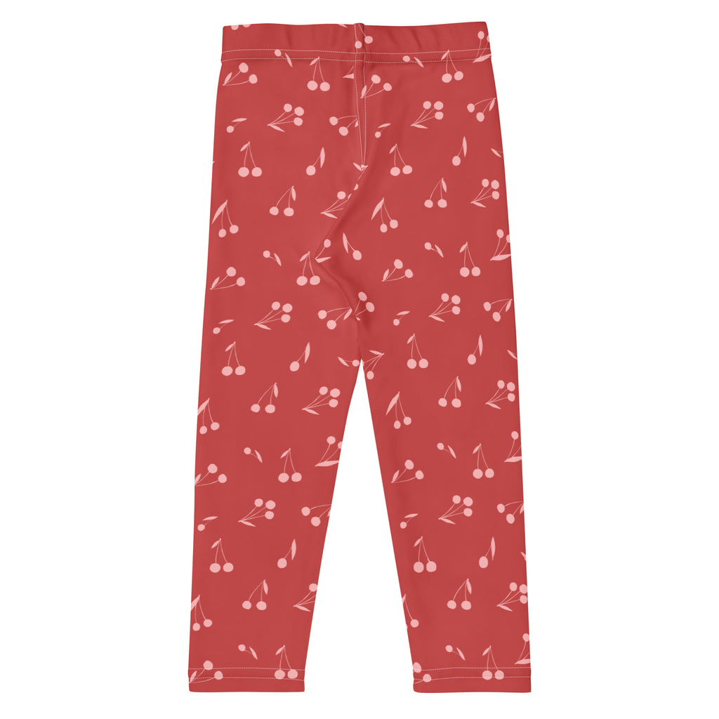 Girls pink cherry pattern buttery soft leggings in red with a repeating light pink cherry design