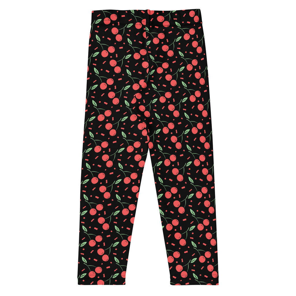 Girls black cherry confetti buttery soft leggings with red cherries green stems leaves and pink rectangular sprinkles pattern